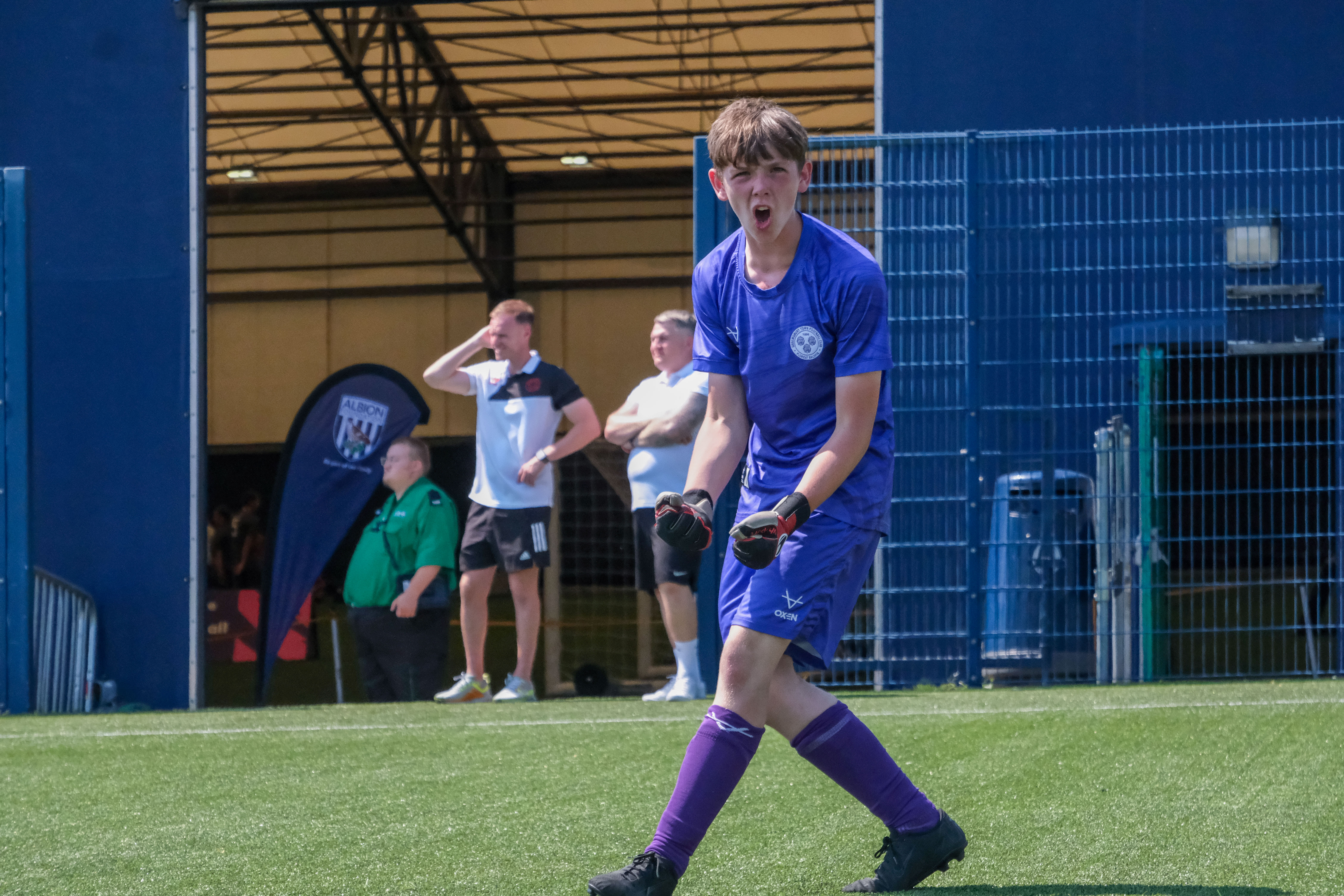 A player celebrating from Shrewsbury Town.