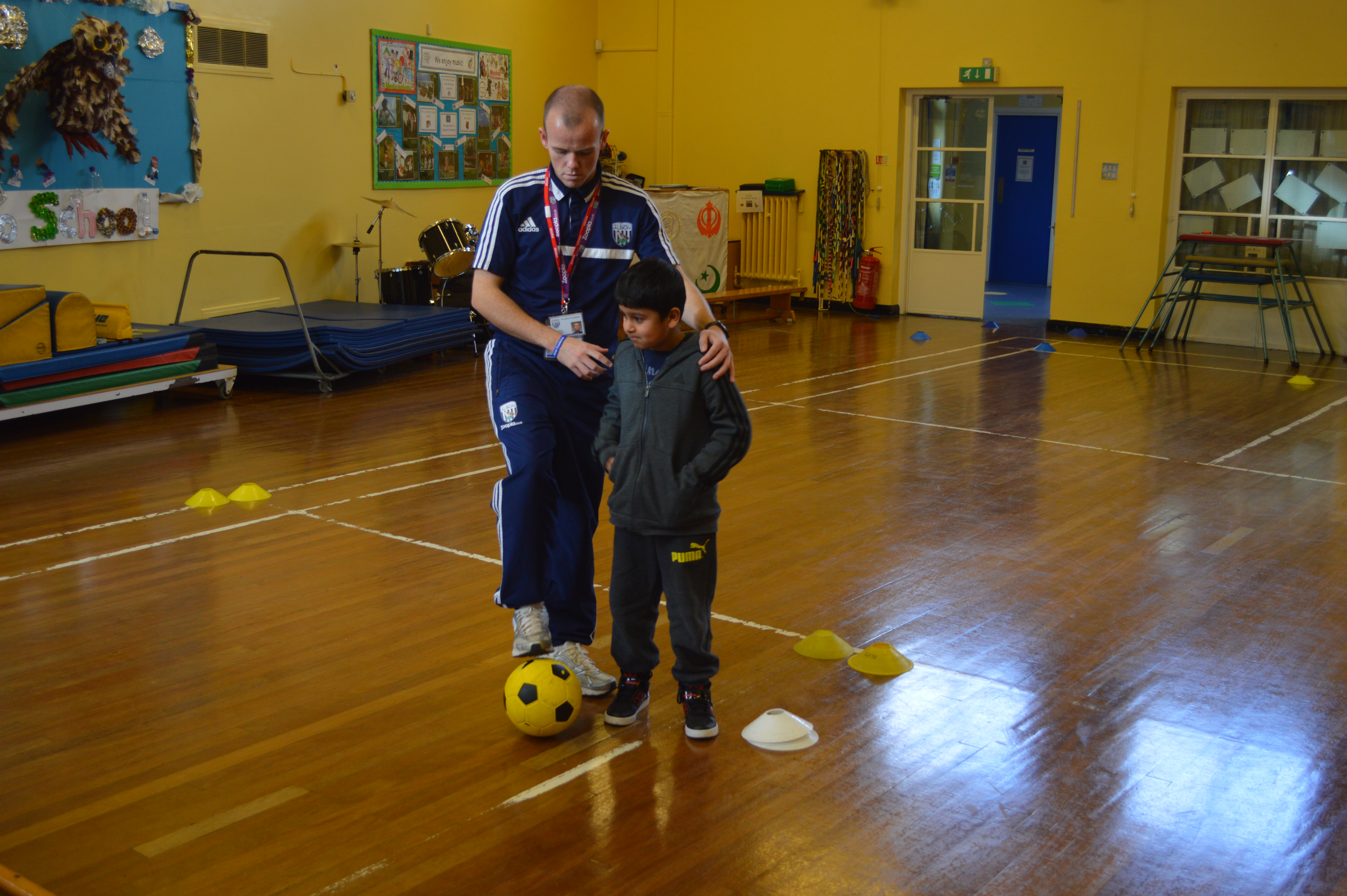 Adrian Dove coaching at a school.