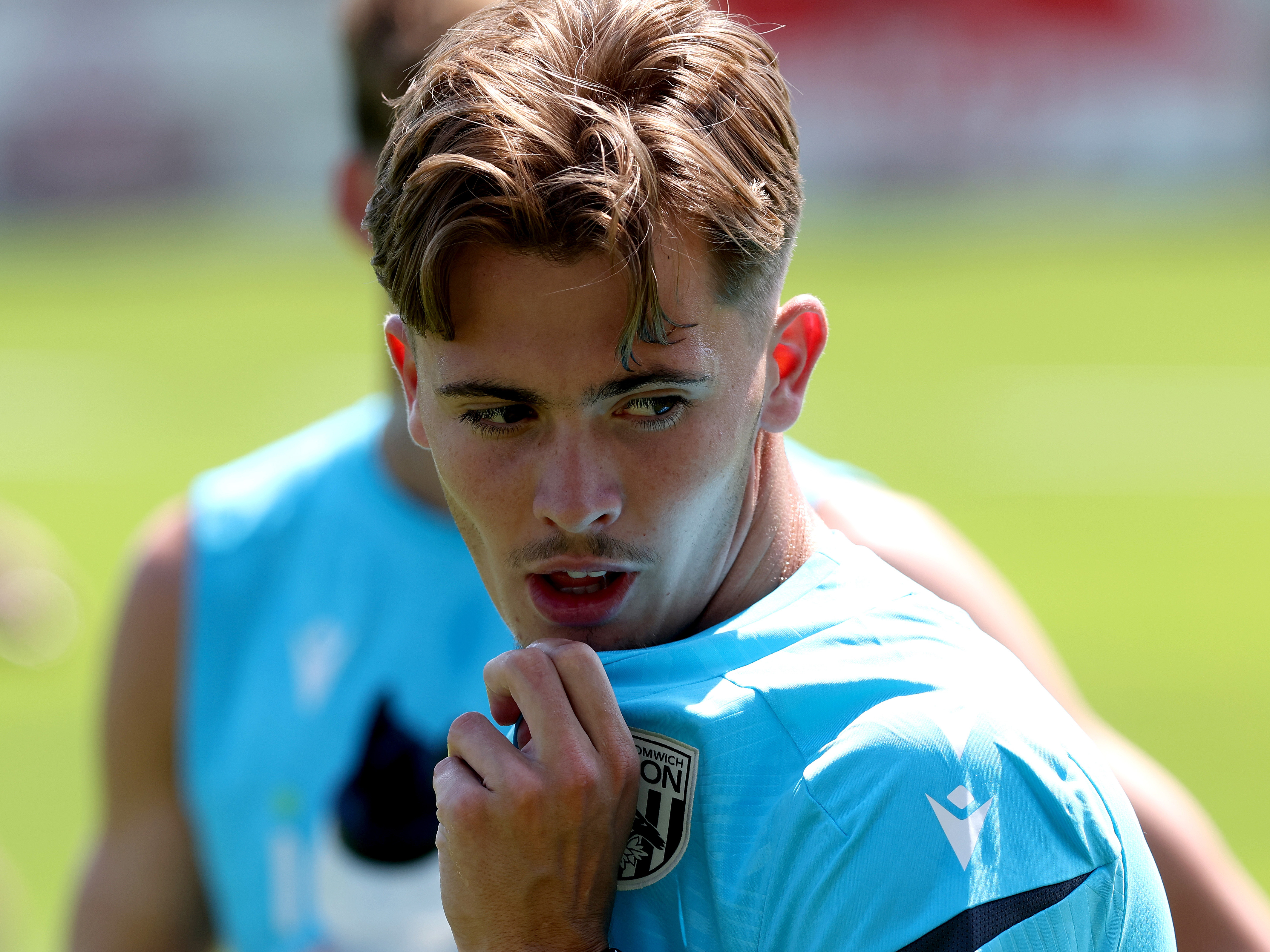 A close up of Isaac Price's face during a training session