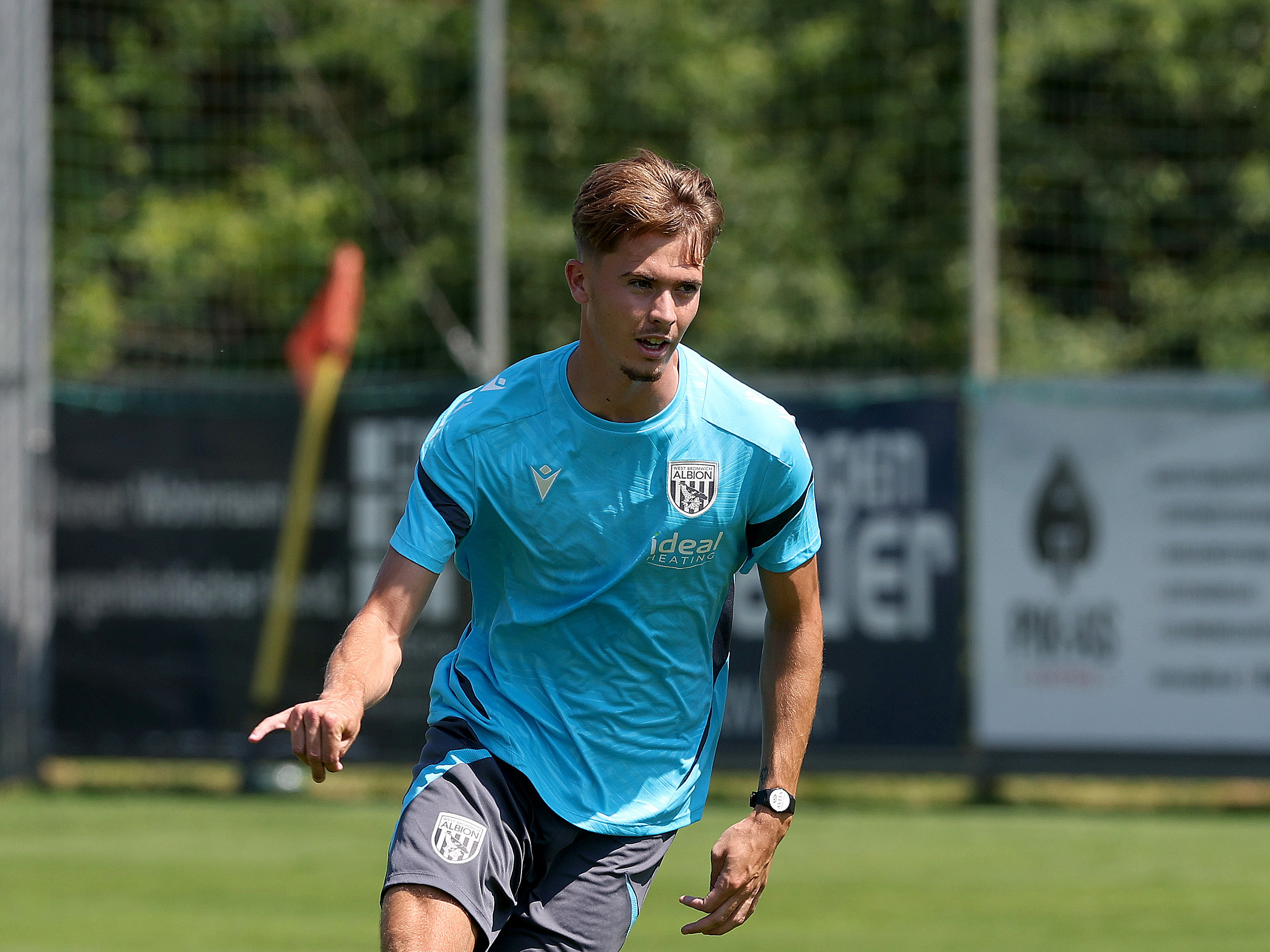 Isaac Price running forward during a training session