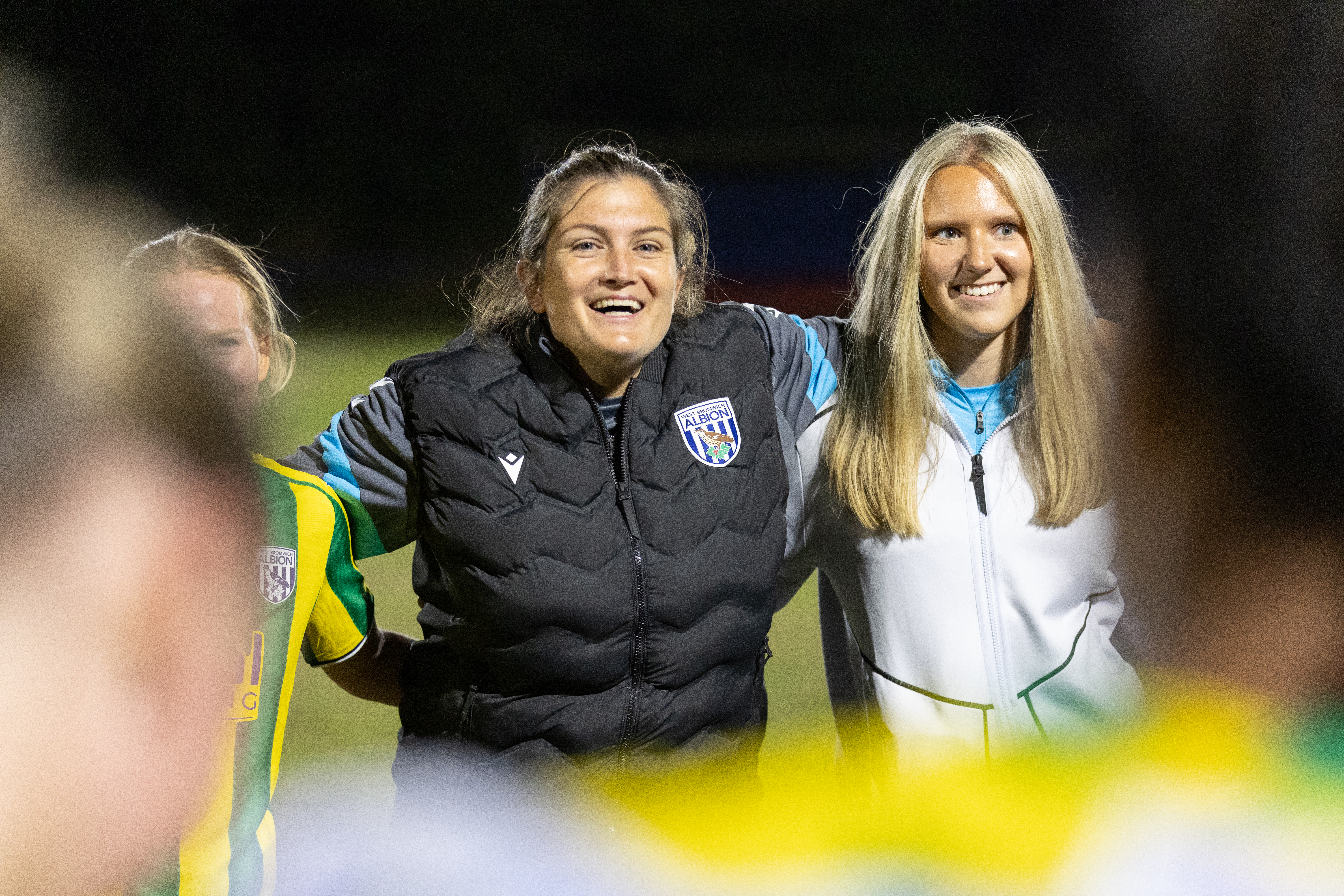 Siobhan Hodgetts-Still smiling while in a team huddle
