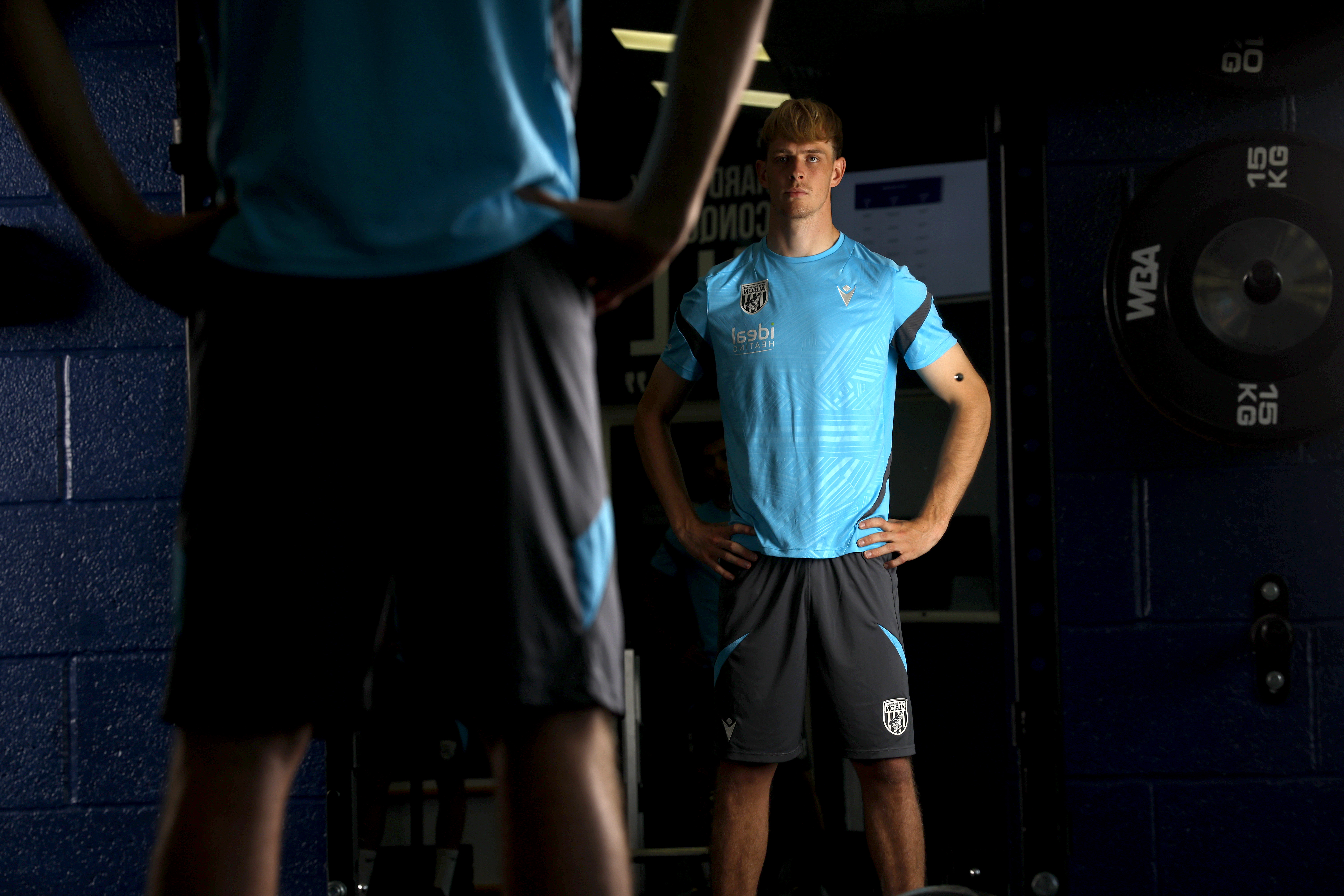 Toby Collyer stood looking at the mirror in the gym