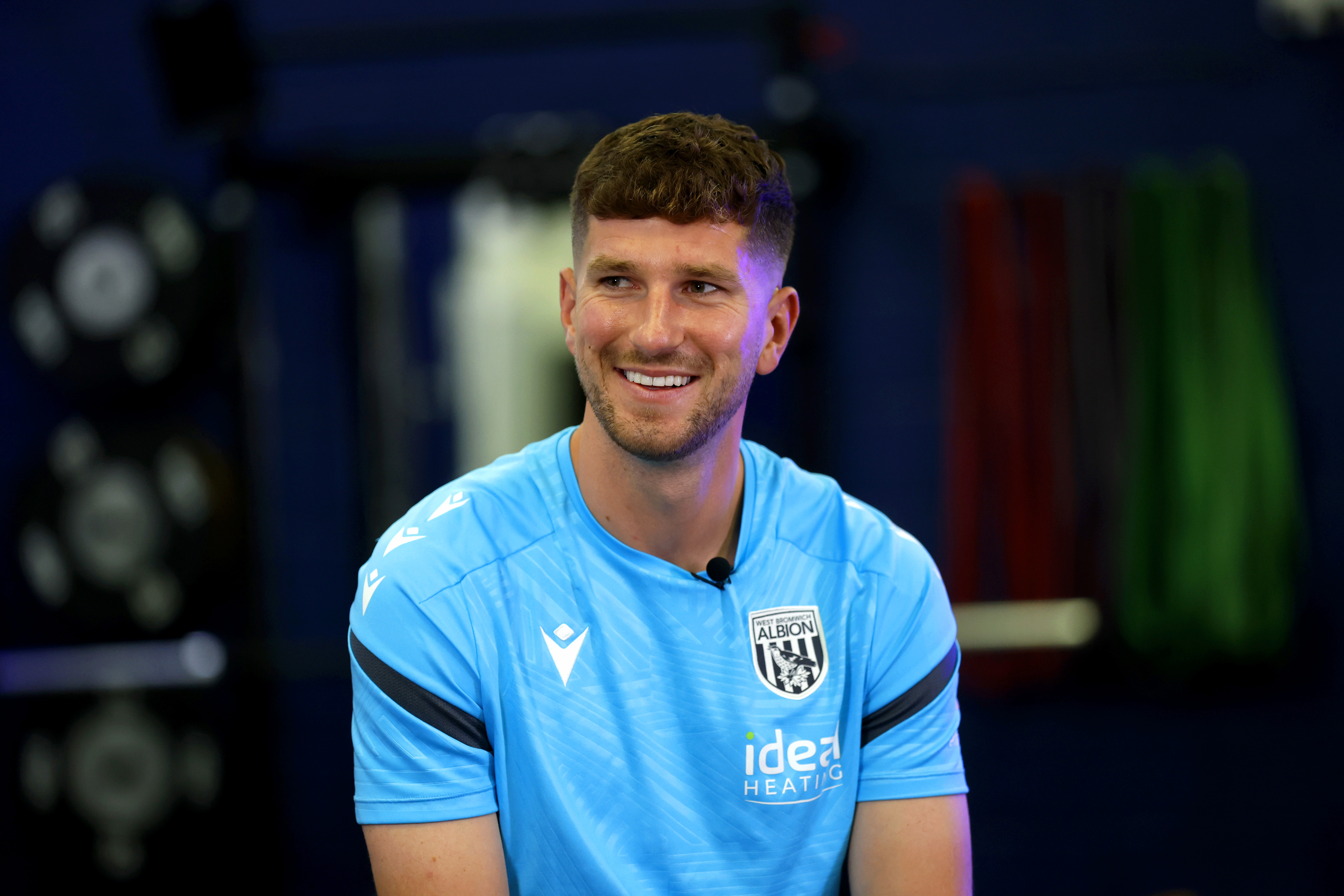 Chris Mepham smiling while sat in the gym