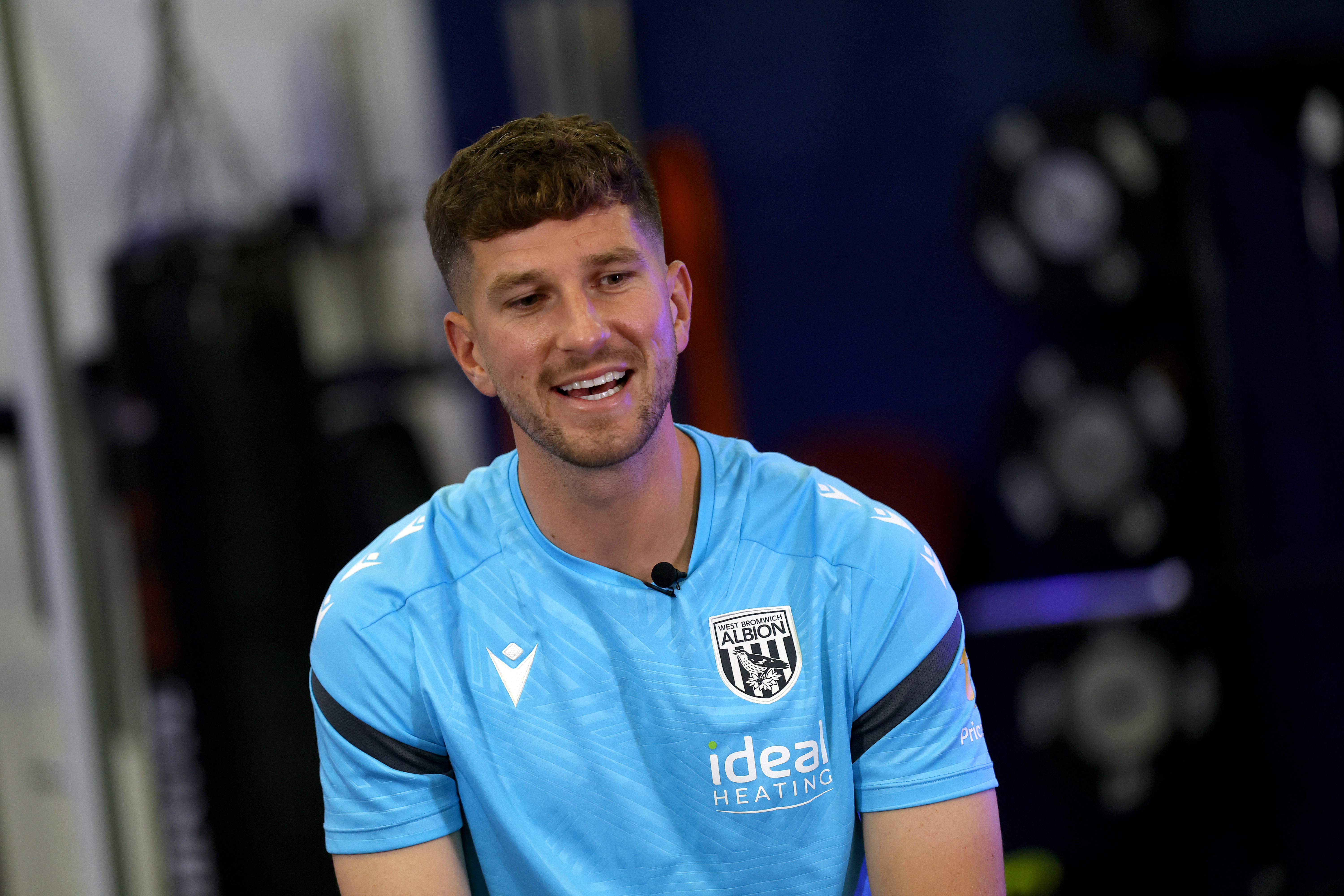 Chris Mepham smiling while sat in the gym