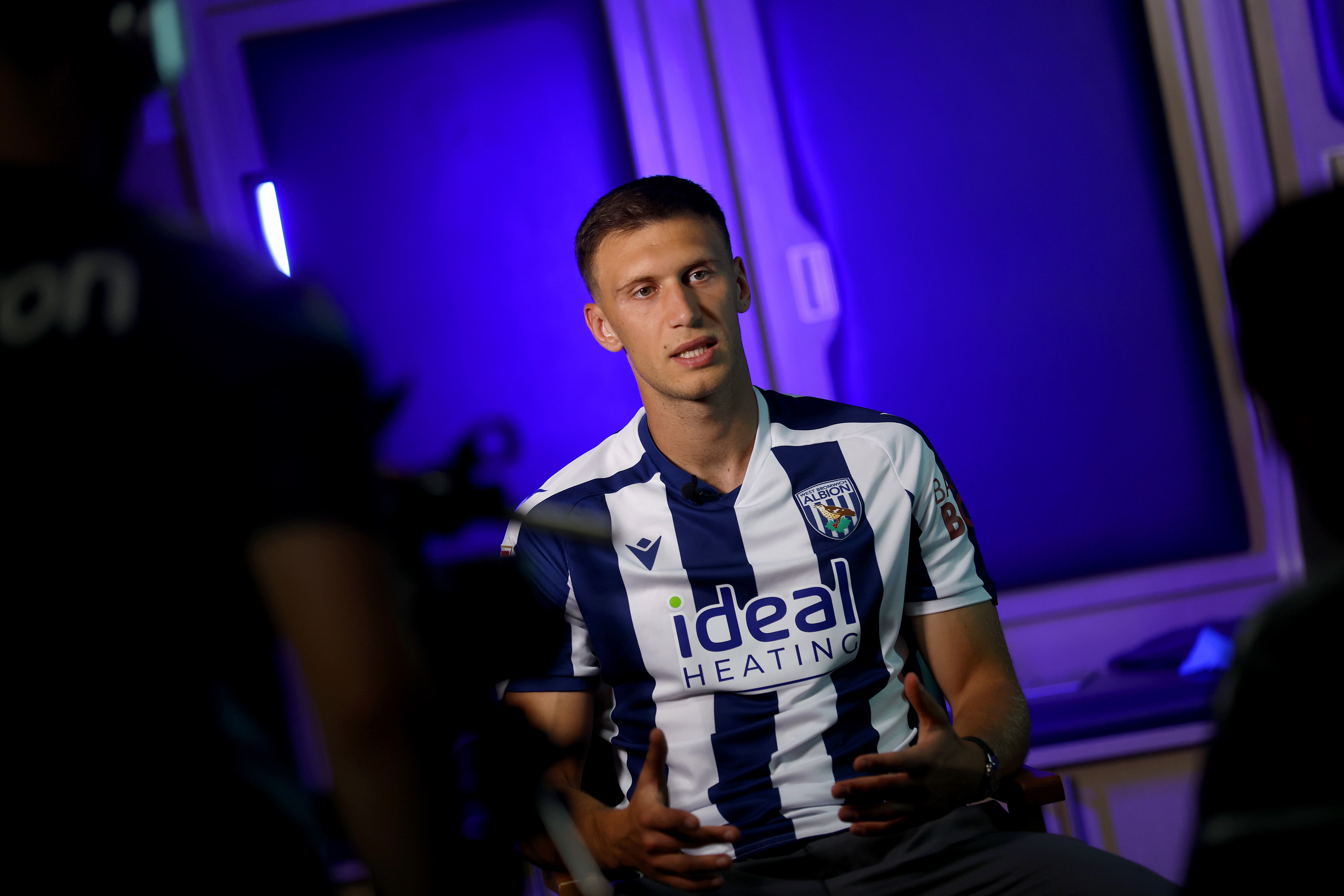 Krystian Bielik in a home shirt being interviewed by WBA TV