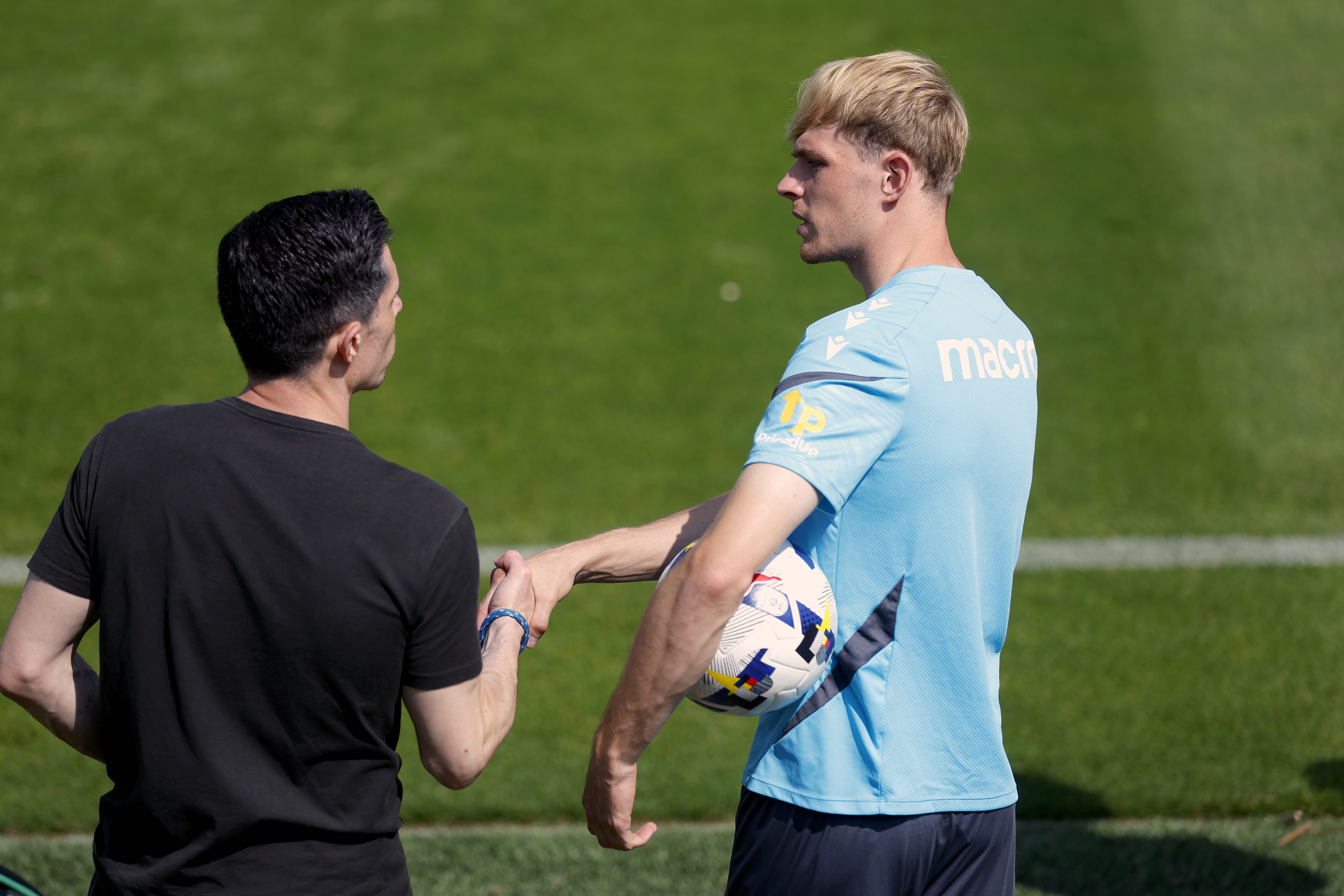 Toby Collyer chatting to Sporting Director Andrew Nestor on the side of the training pitch 