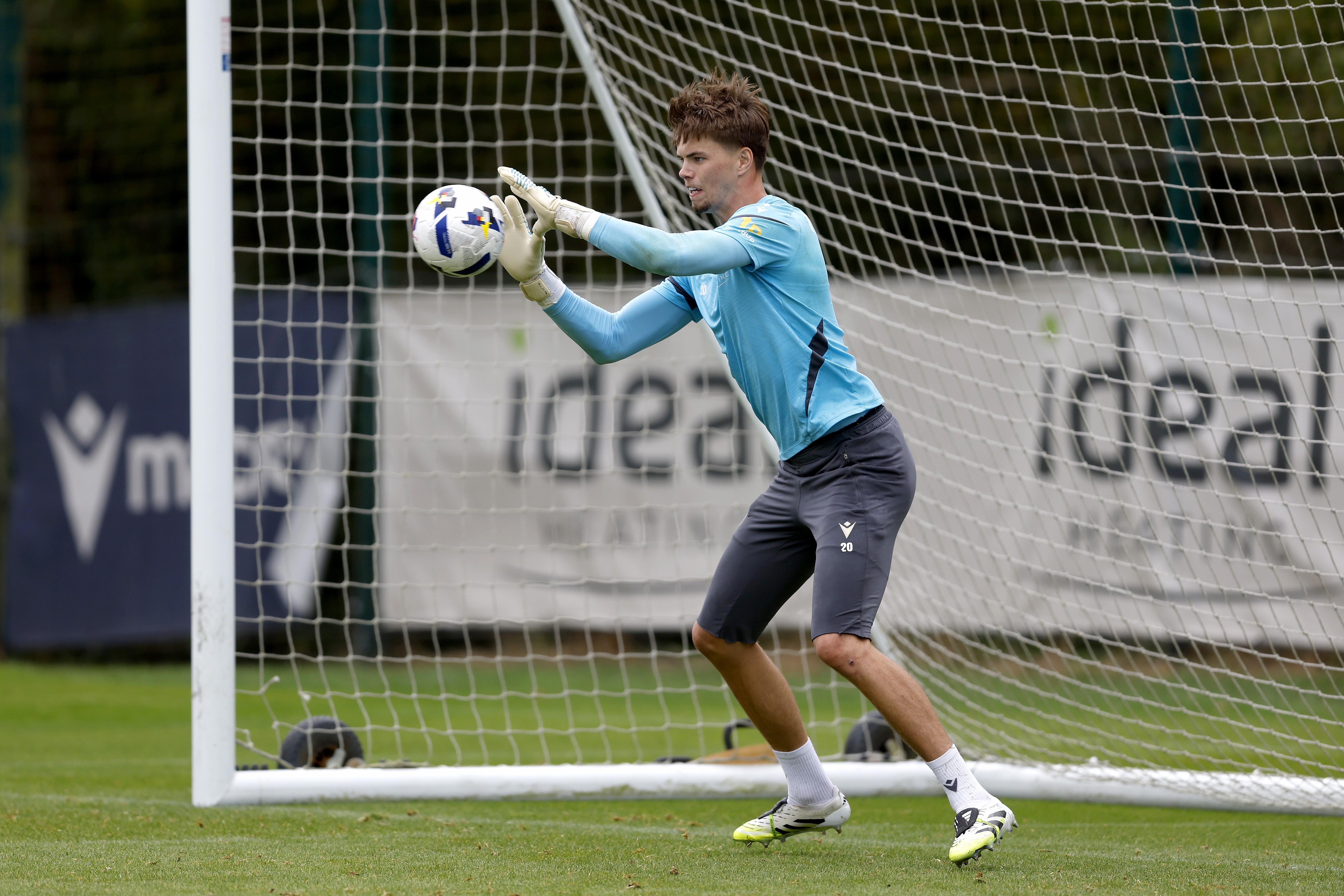 Josh Griffiths catching a ball during a training session