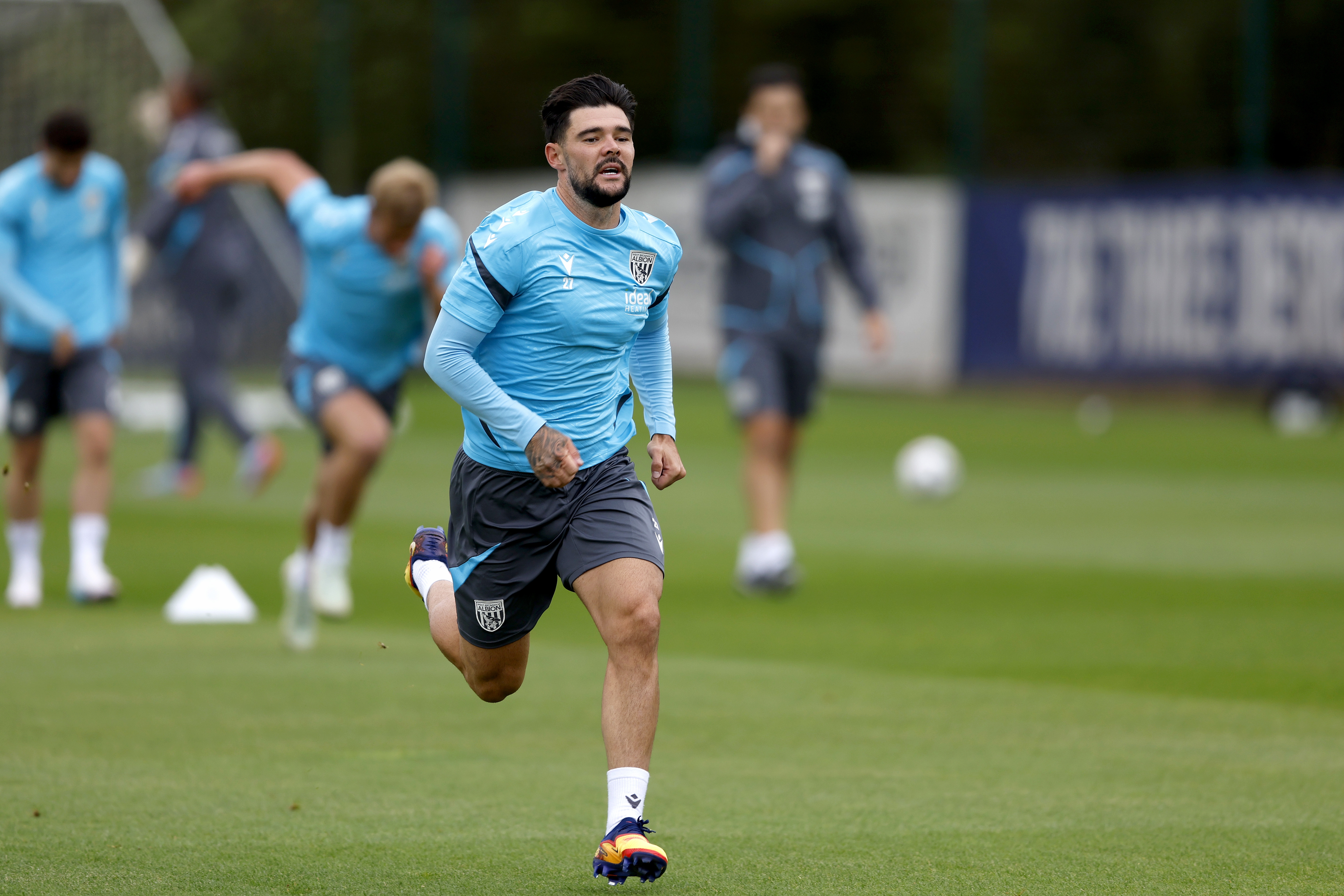 Alex Mowatt running forward during training 