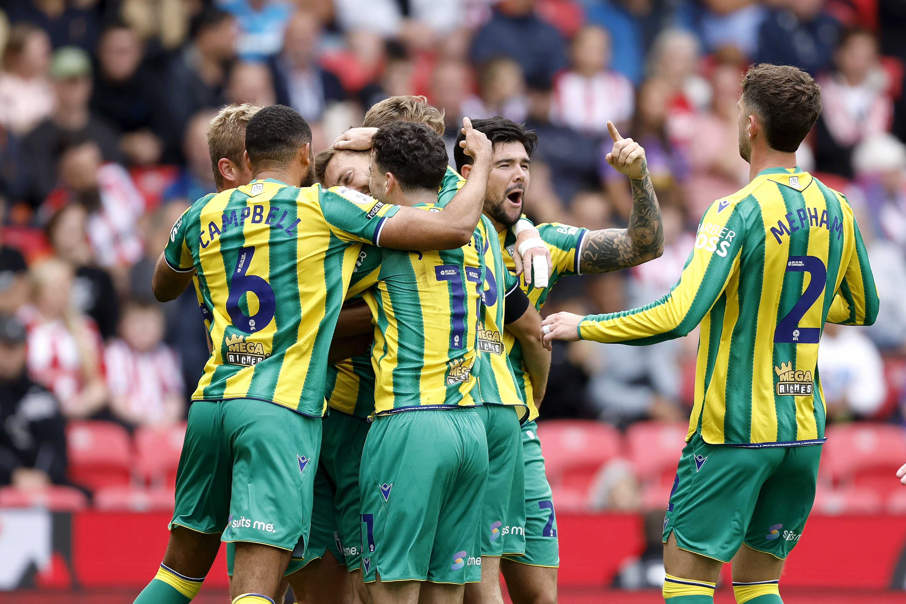 Nat Phillips celebrates scoring v Stoke with team-mates