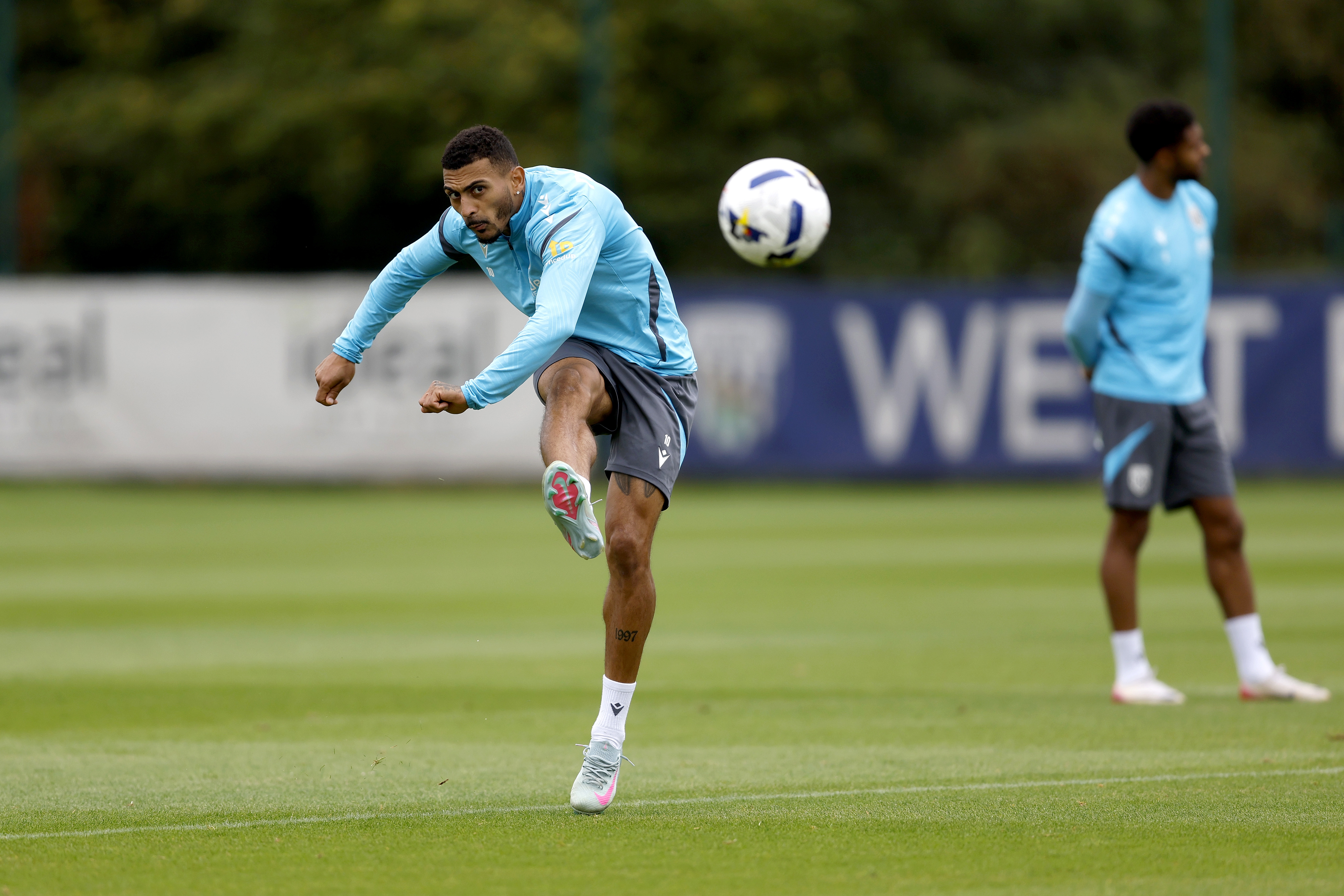 Karlan Grant striking the ball during training 