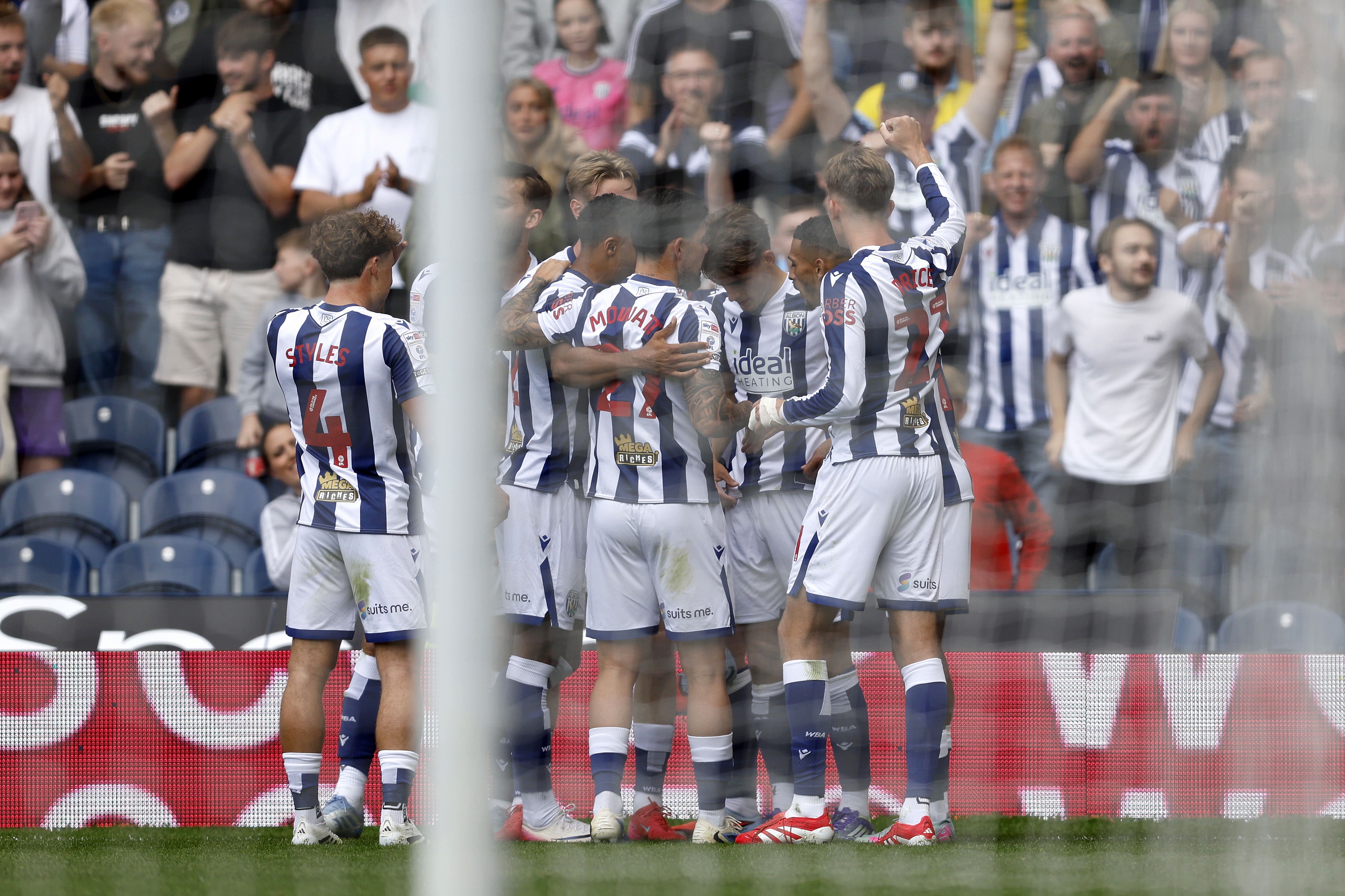 Isaac Price celebrates with team-mates after scoring against Blackburn 