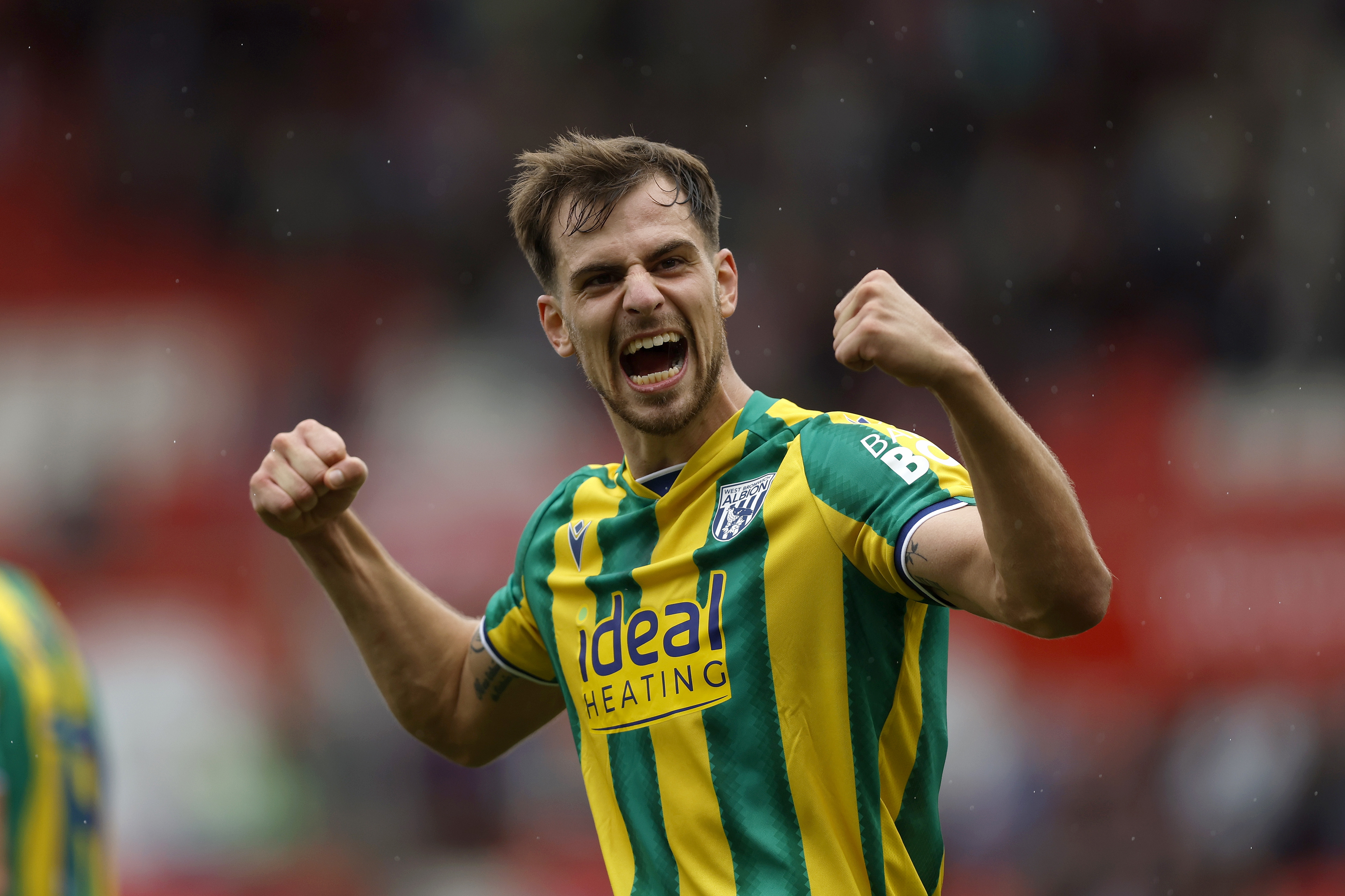 Jayson Molumby applauding WBA fans at Stoke