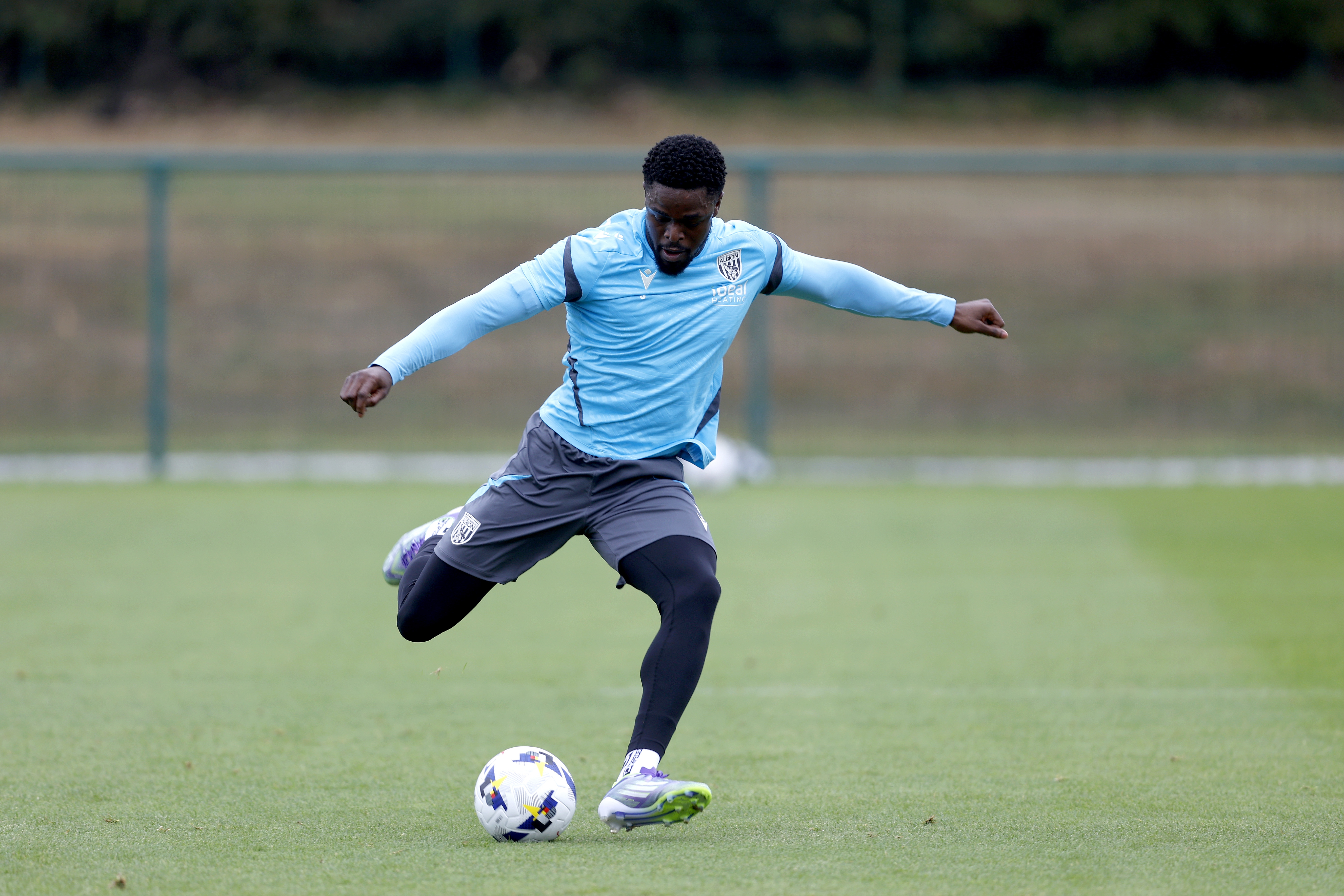 Josh Griffiths striking the ball during training 