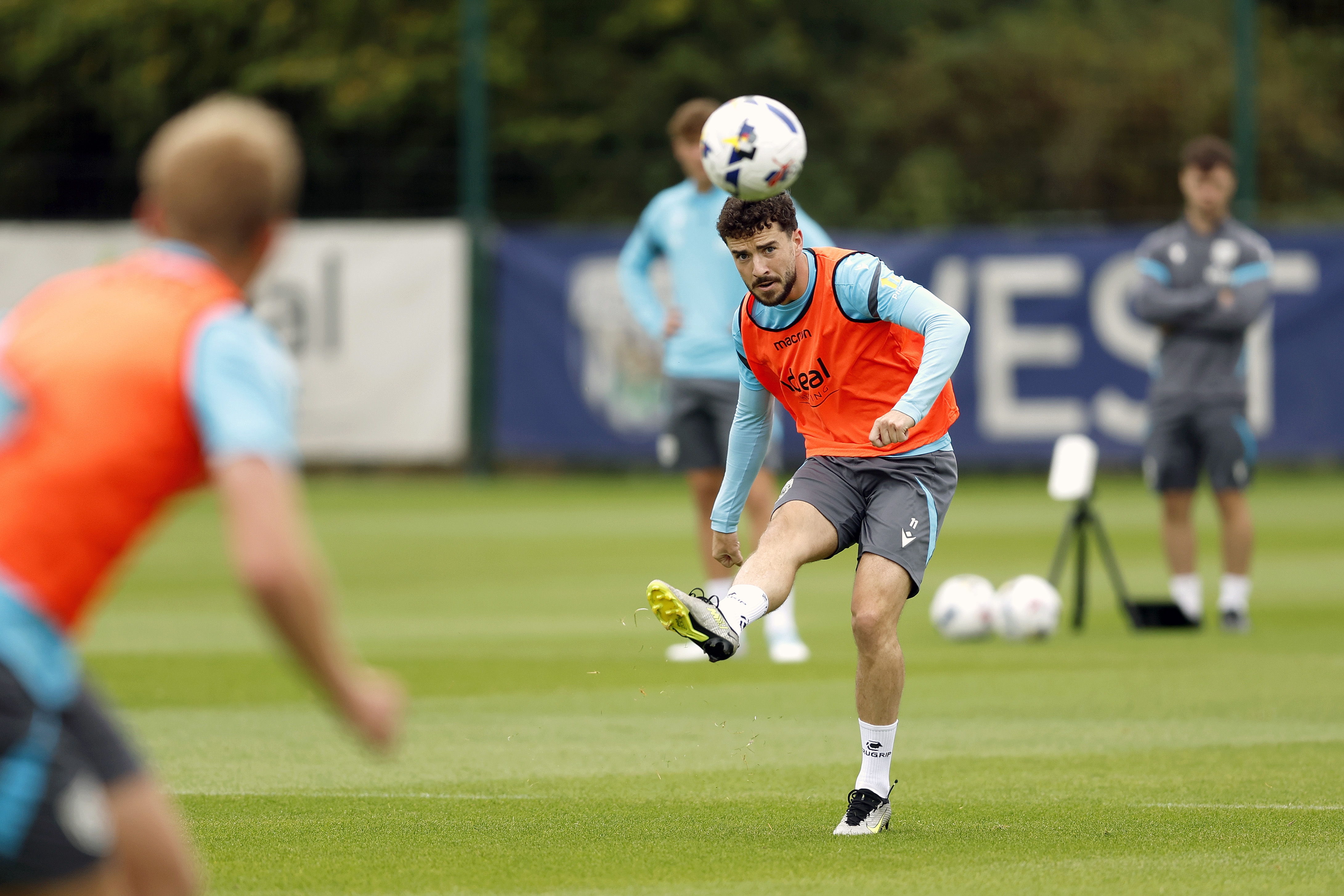Mikey Johnston striking the ball during training 