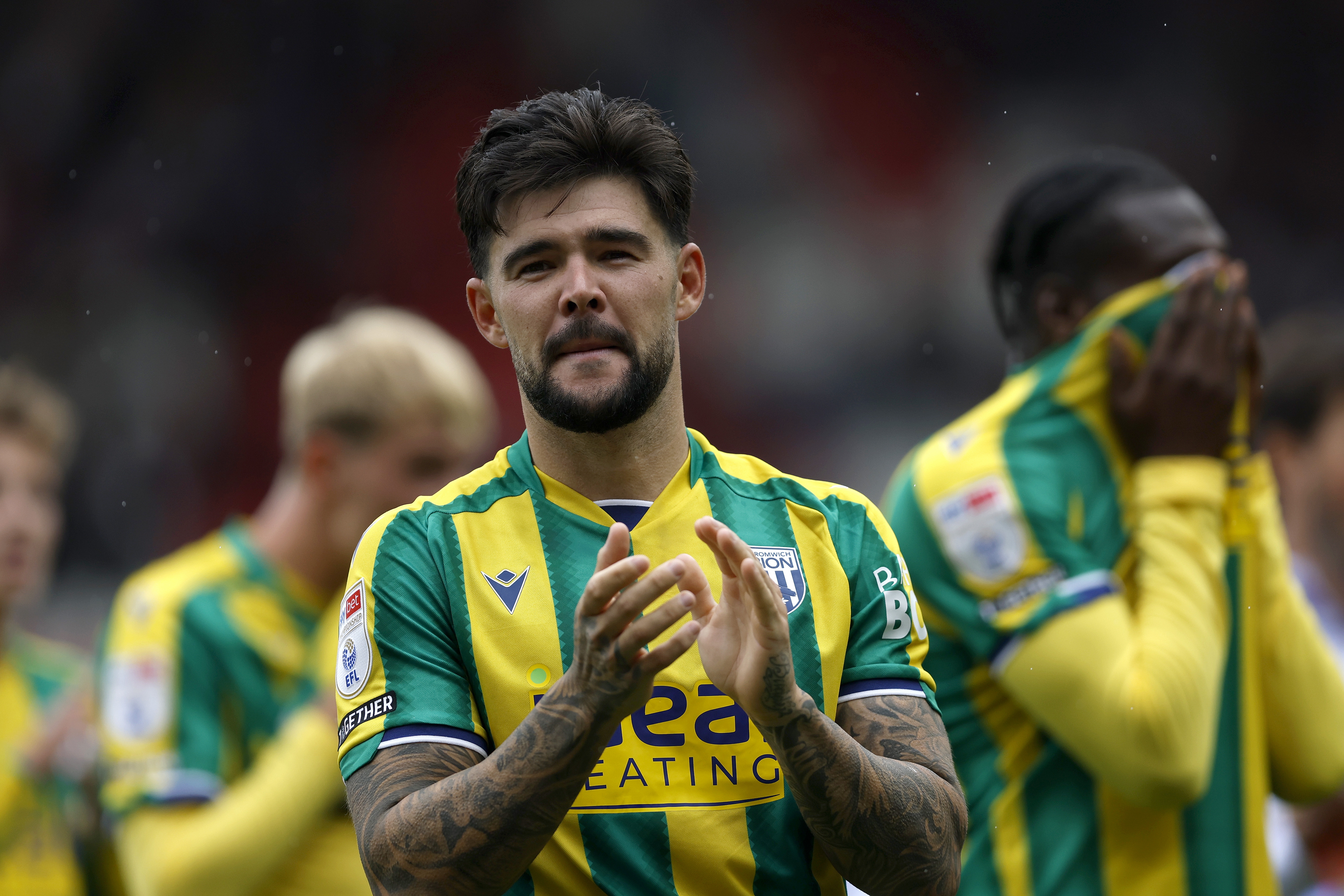 Alex Mowatt applauding WBA fans at Stoke