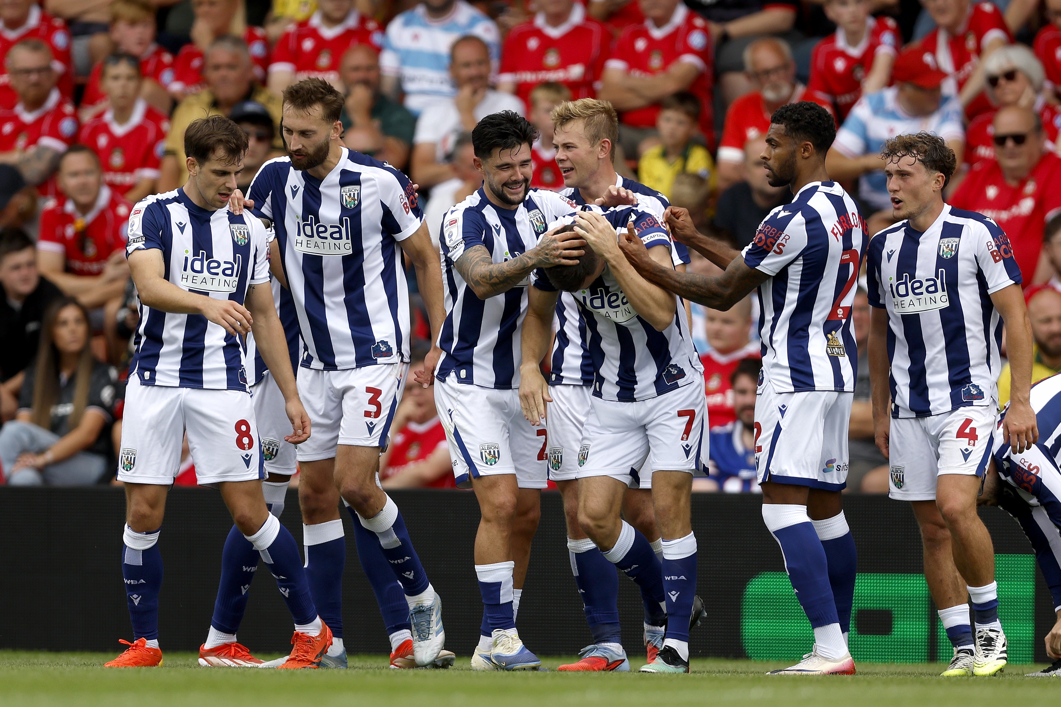 Jed Wallace celebrates with team-mates after scoring against Wrexham