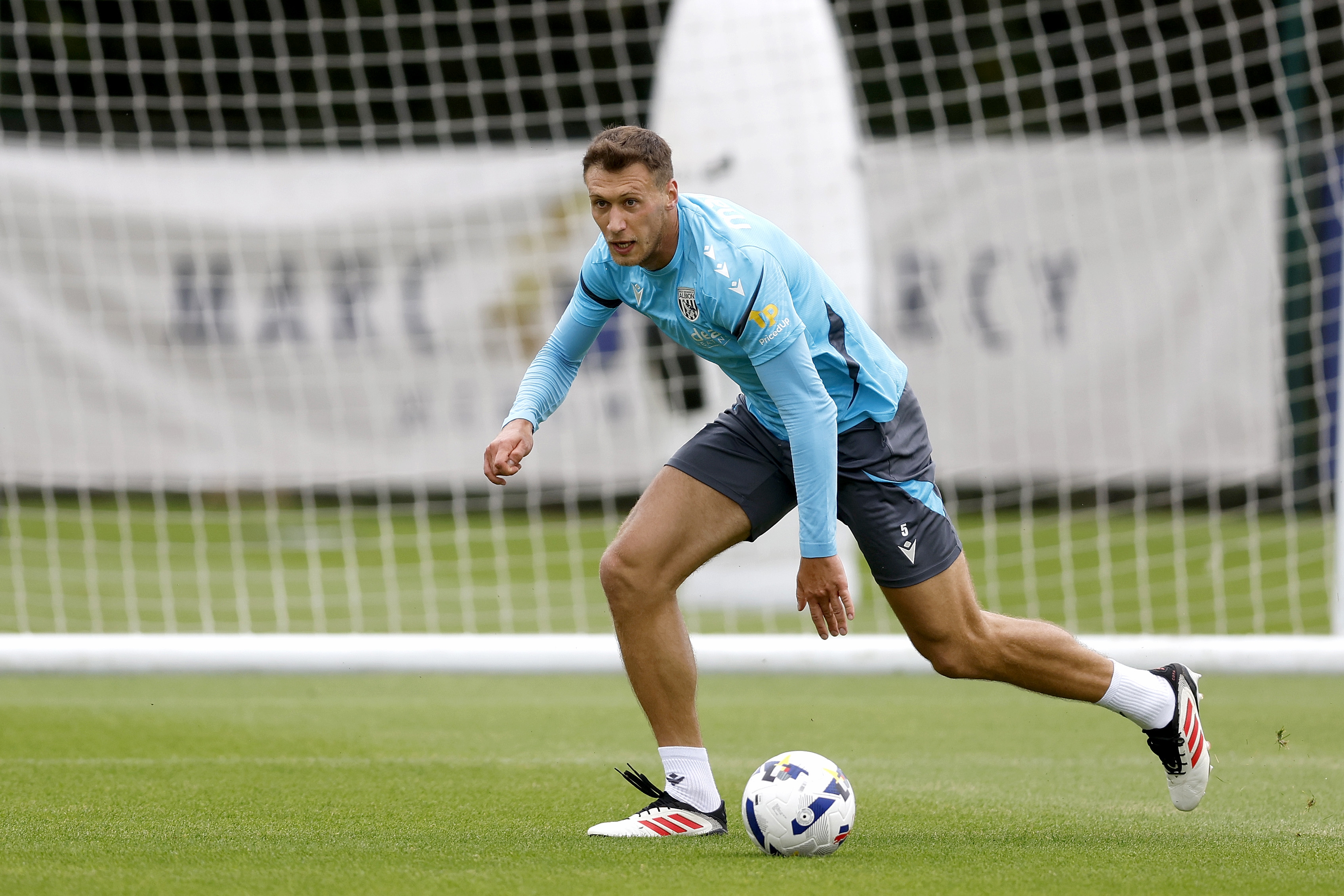 Krystian Bielik on the ball during training 