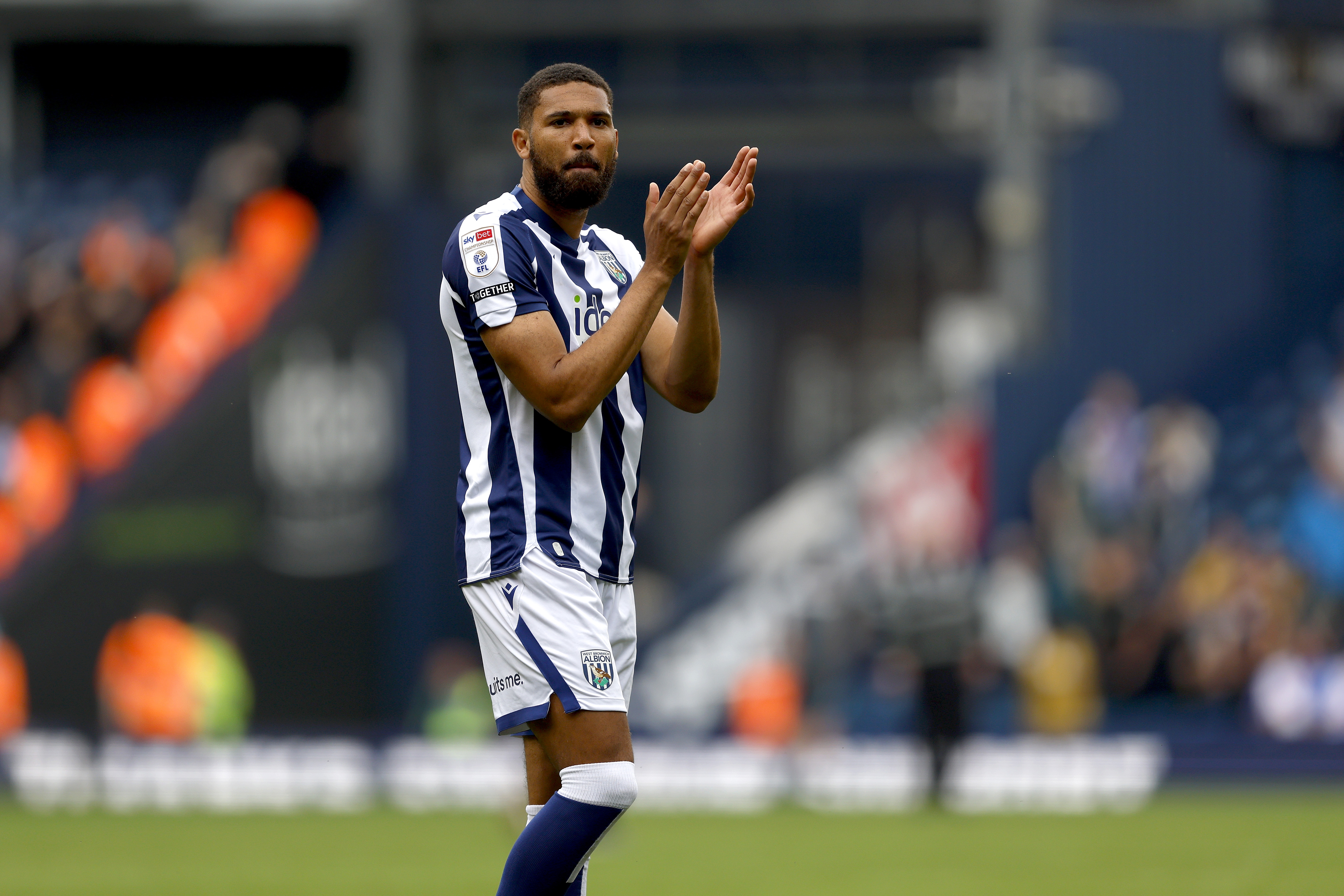 George Campbell applauding WBA fans after the win over Blackburn