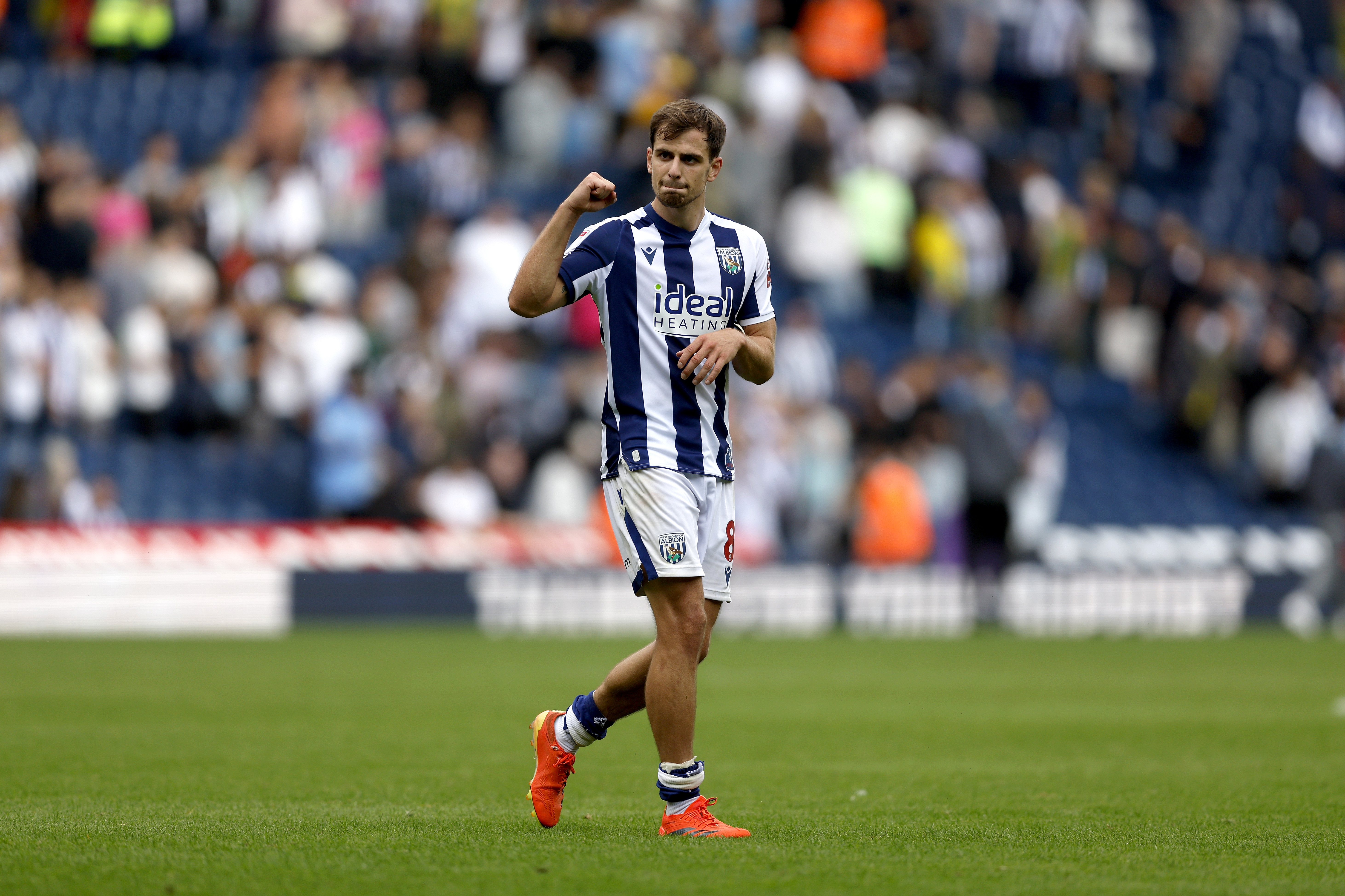 Jayson Molumby applauding WBA fans after the win over Blackburn