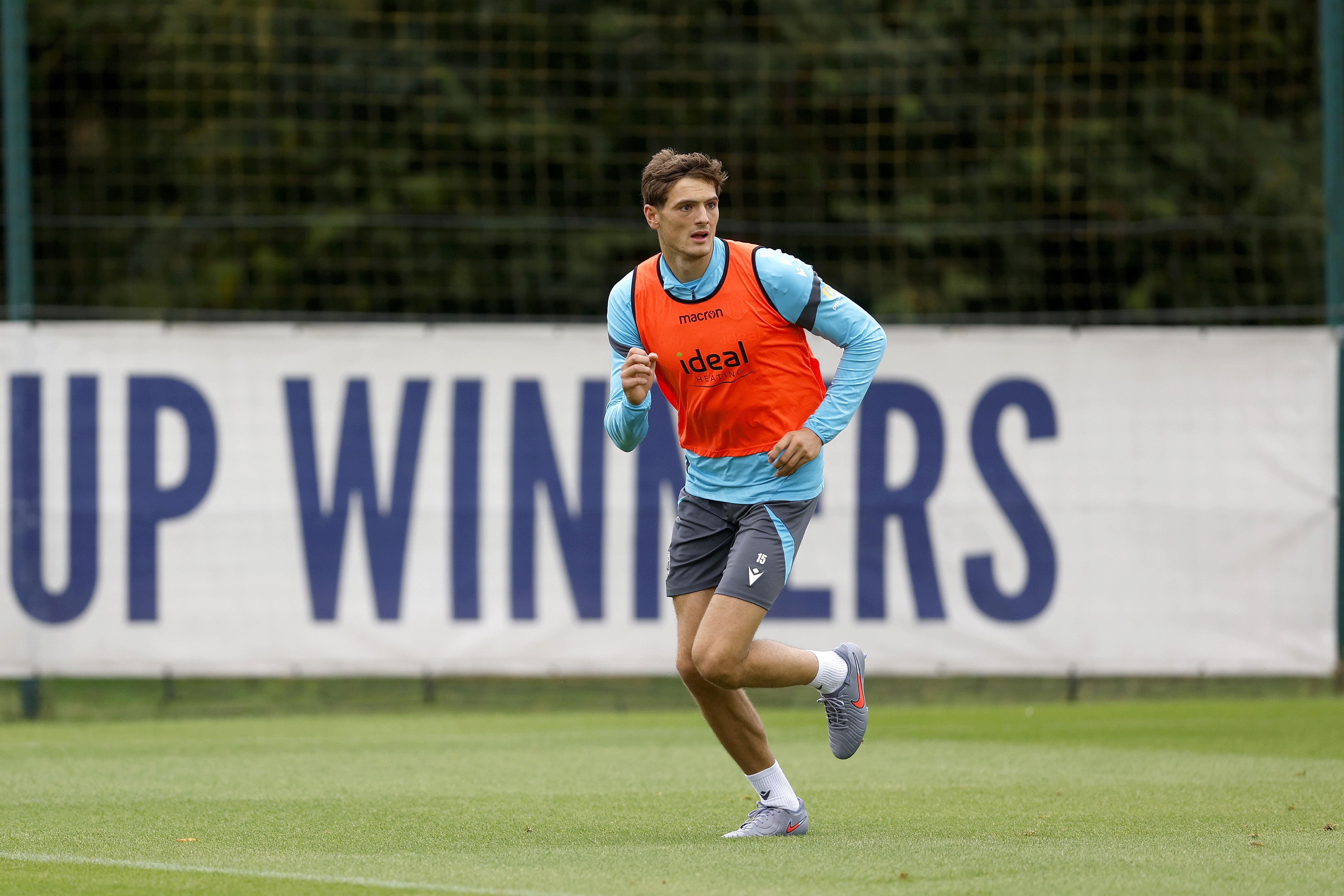 Caleb Taylor running forward during training 