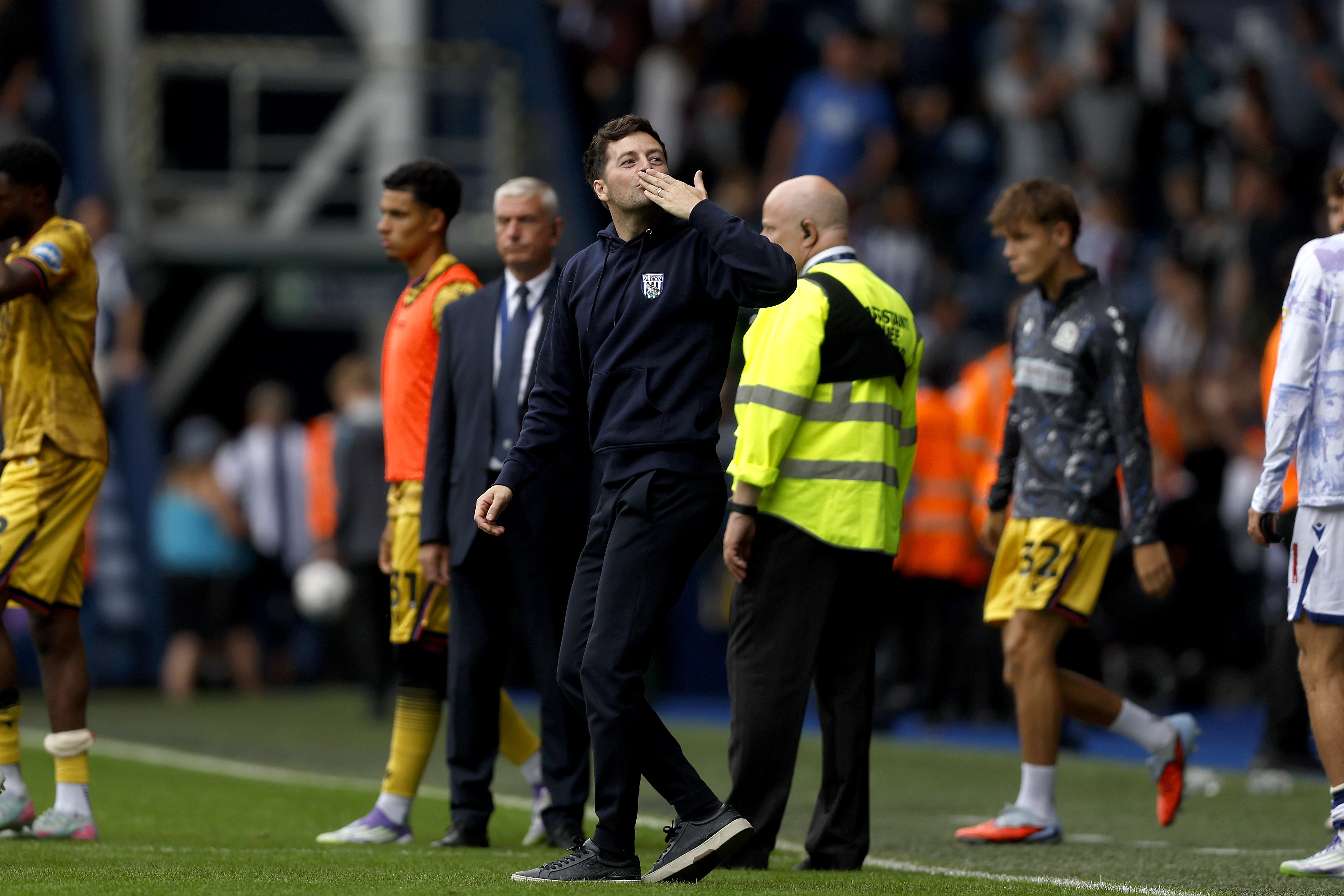 Ryan Mason blowing a kiss to his family while stood on the side of the pitch at The Hawthorns