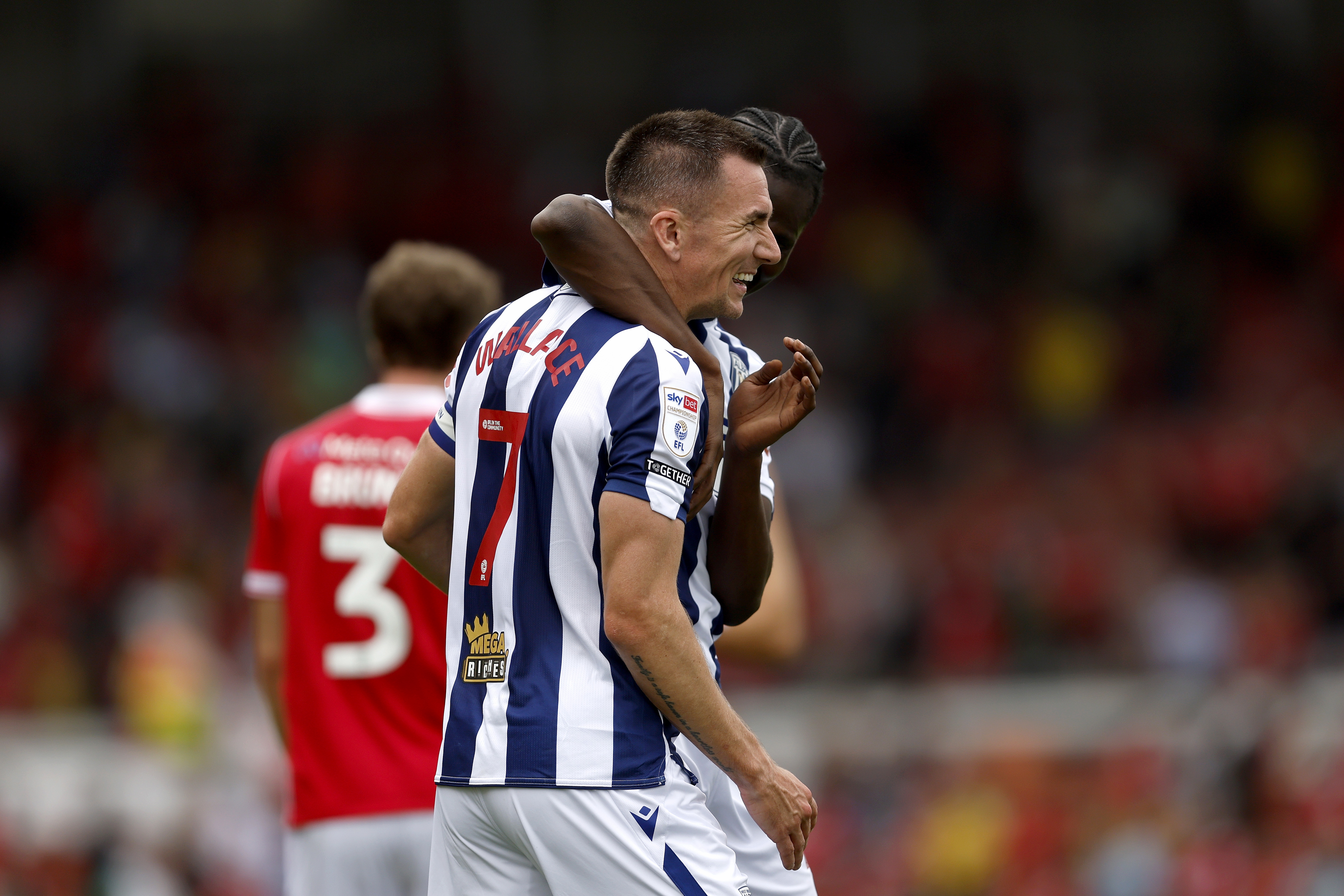 Jed Wallace laughing after beating Wrexham