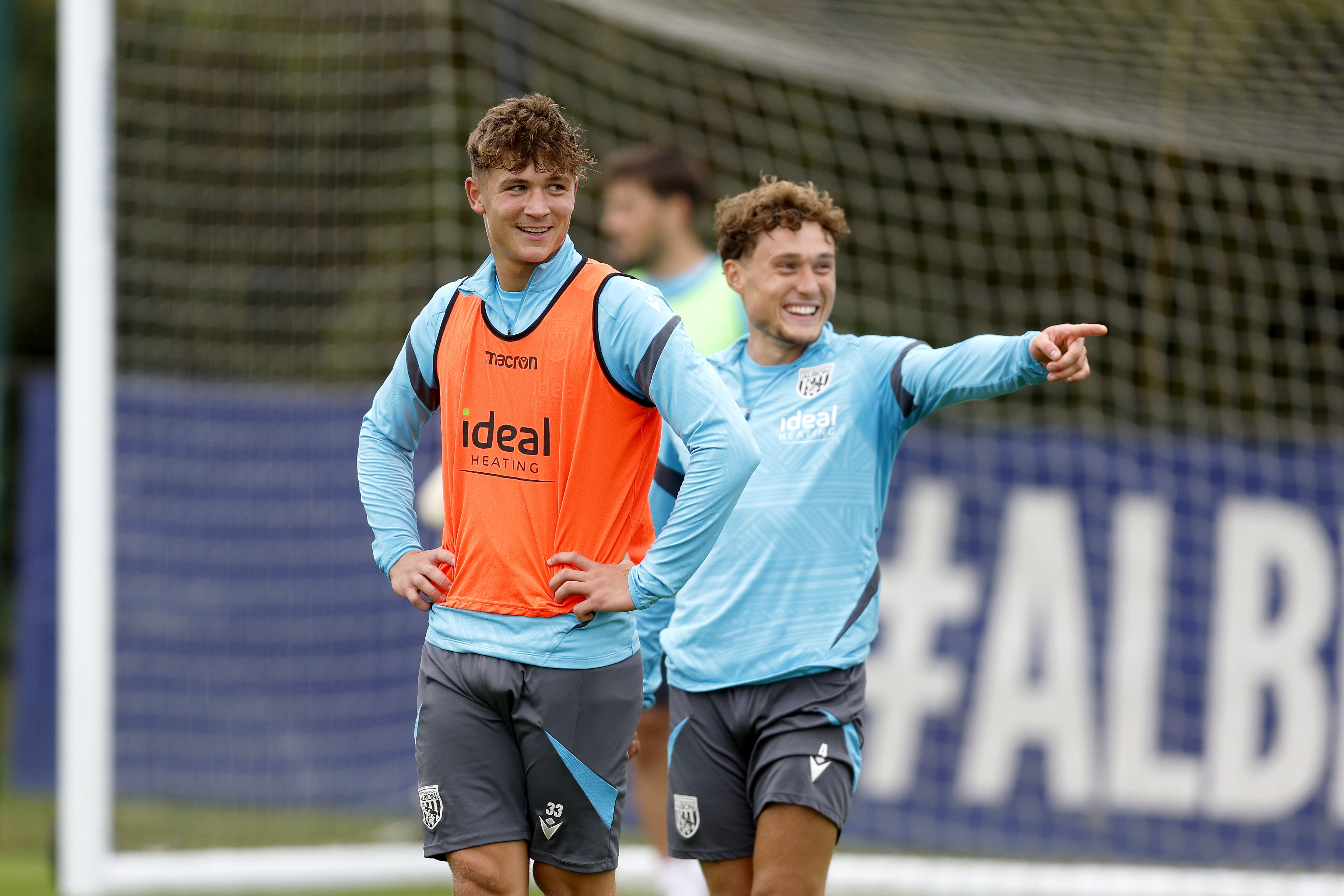 Cole Deeming and Callum Styles laughing during training 
