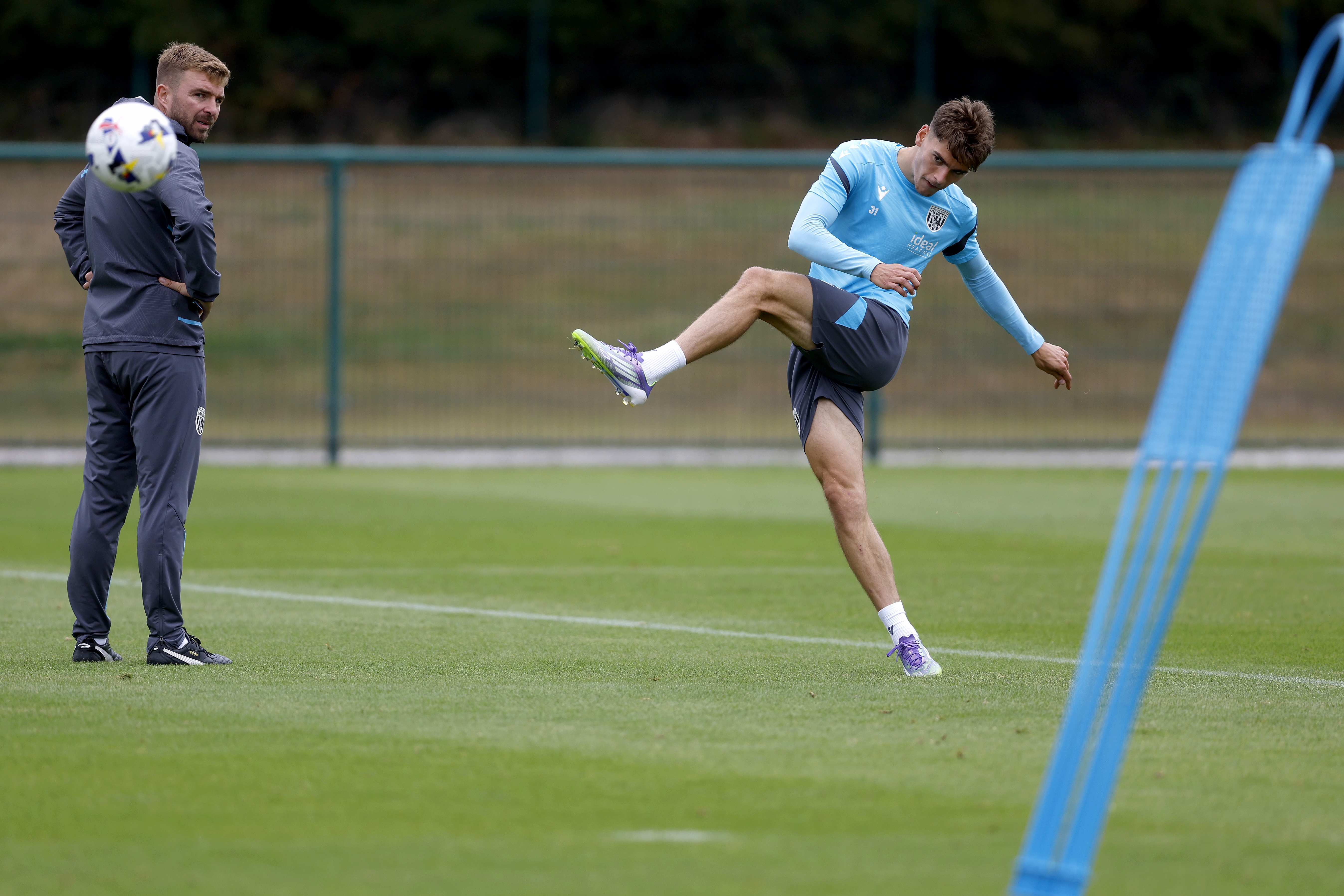 Tom Fellows striking the ball during training 