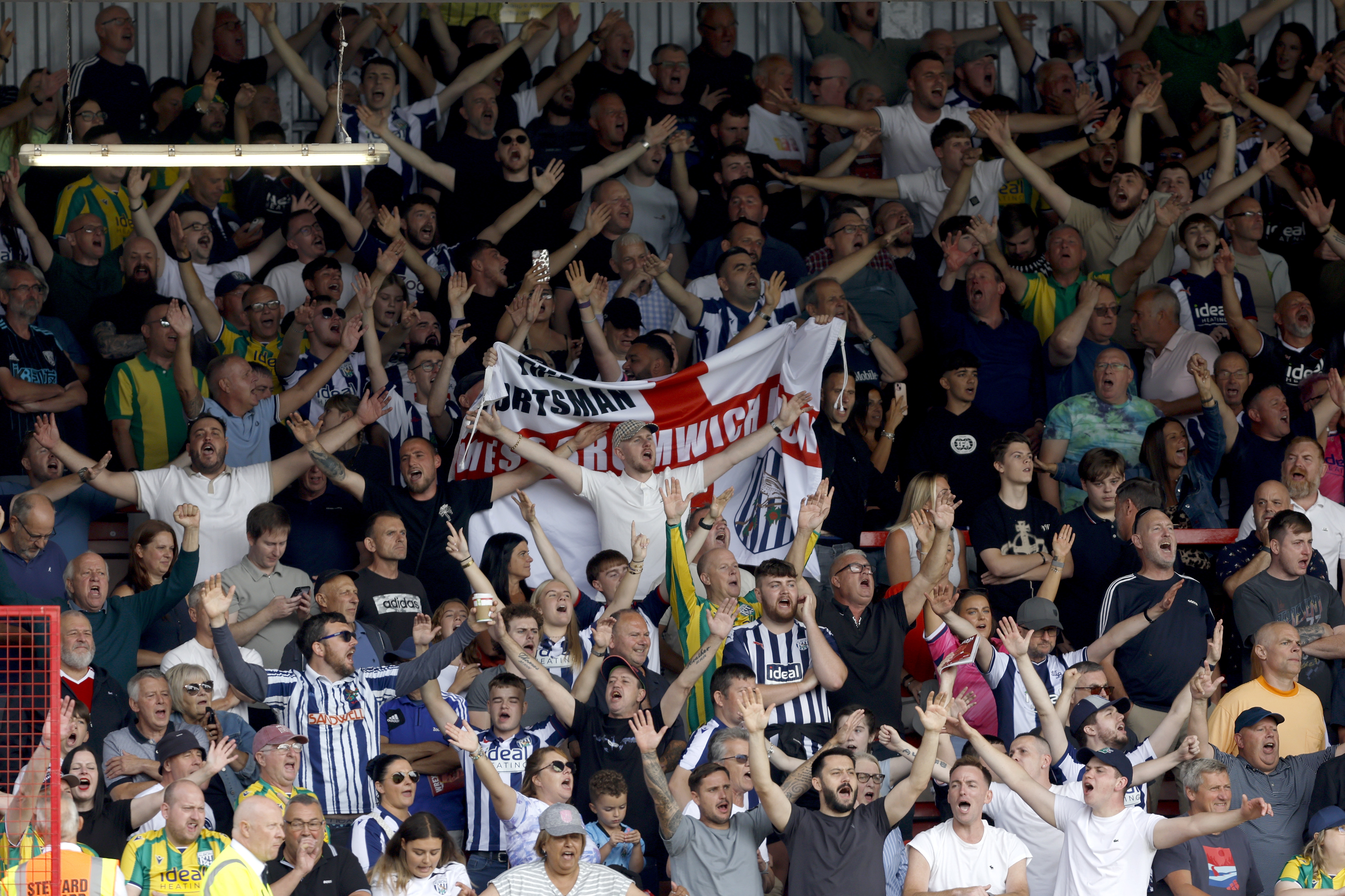 A general view of WBA fans celebrating in the stand at Wrexham 