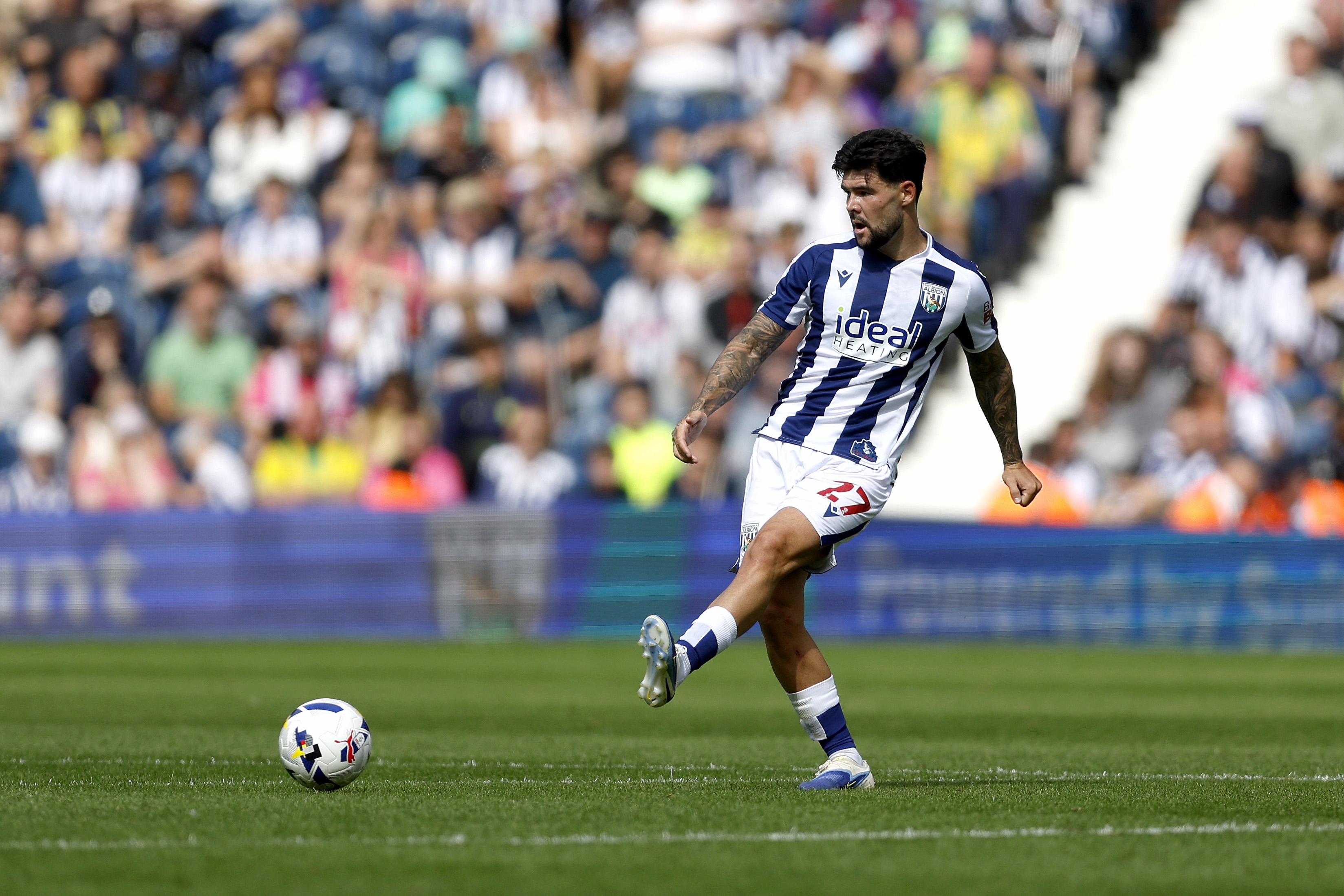 Alex Mowatt passing the ball against Blackburn