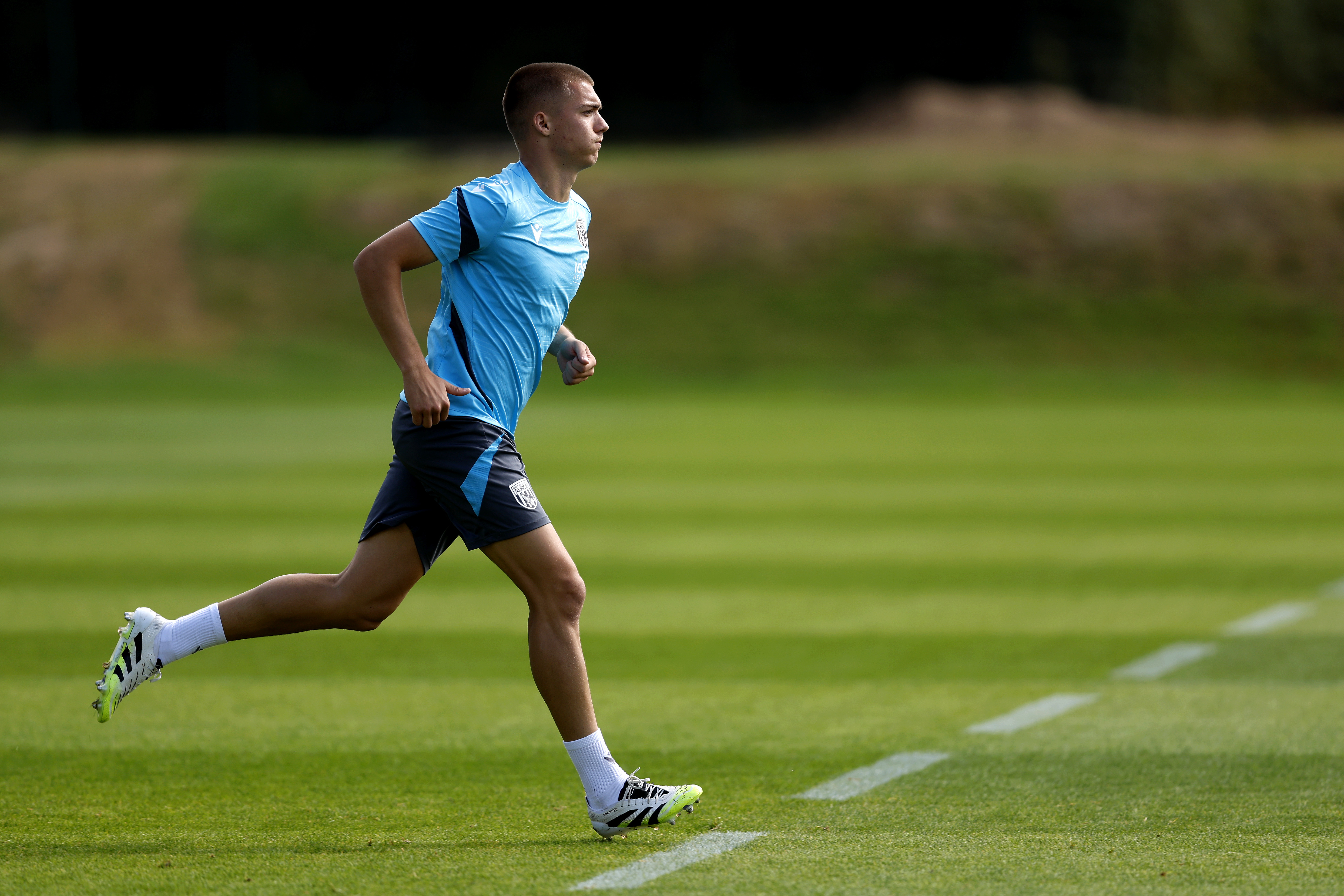Alfie Gilchrist running in training 