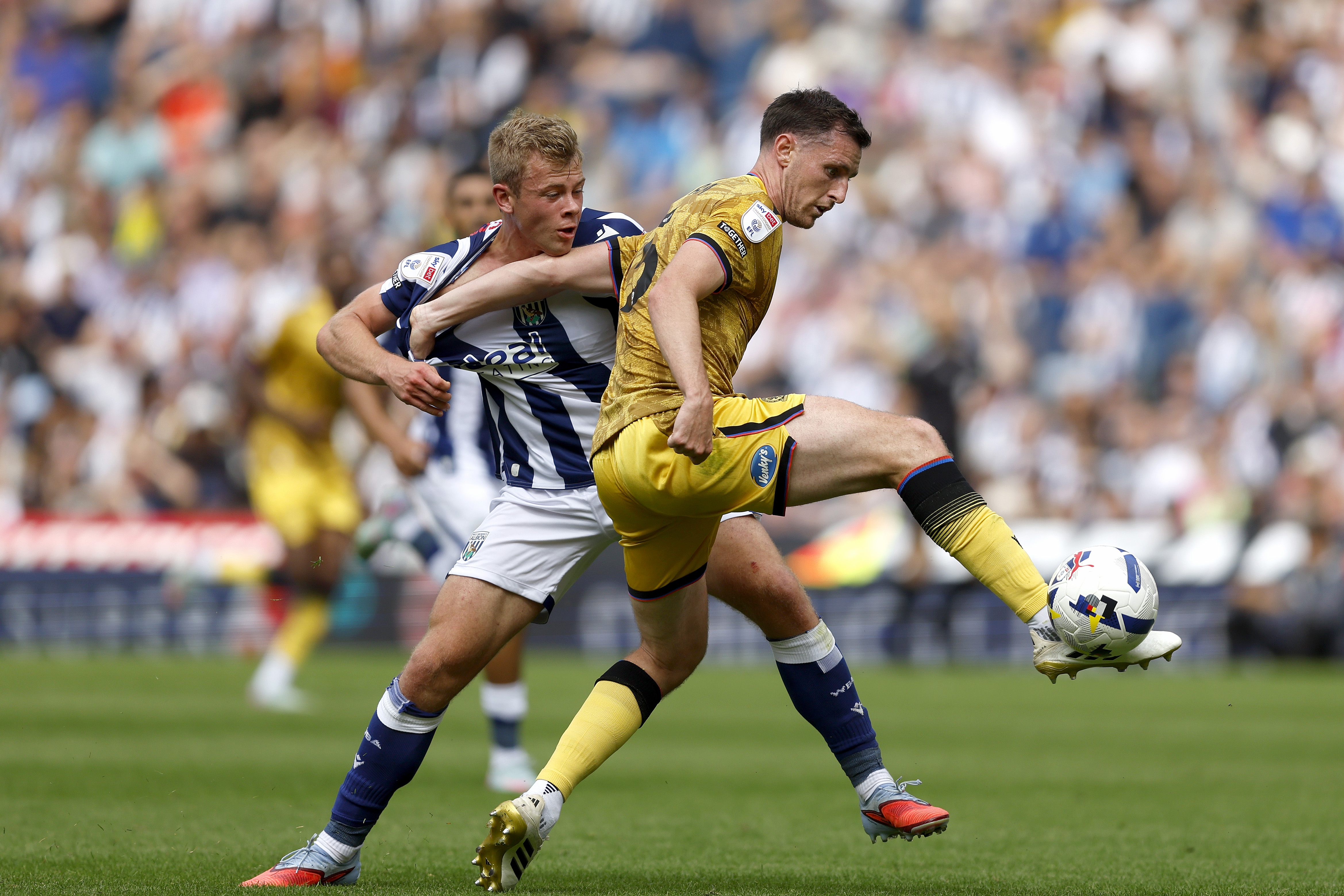Aune Heggebø fighting for the ball with a Blackburn player