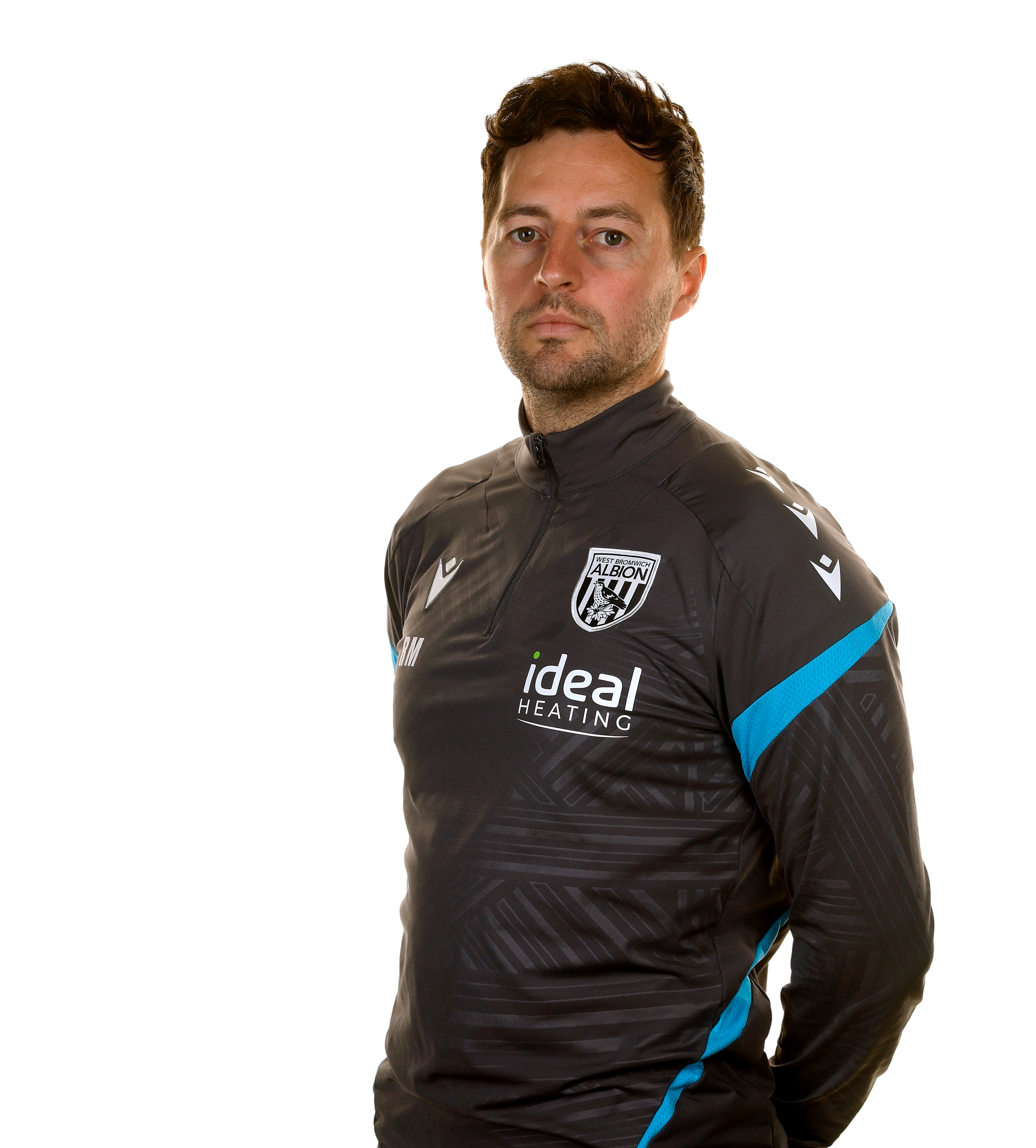 A photo of Albion head coach Ryan Mason in the 2025/26 grey training kit