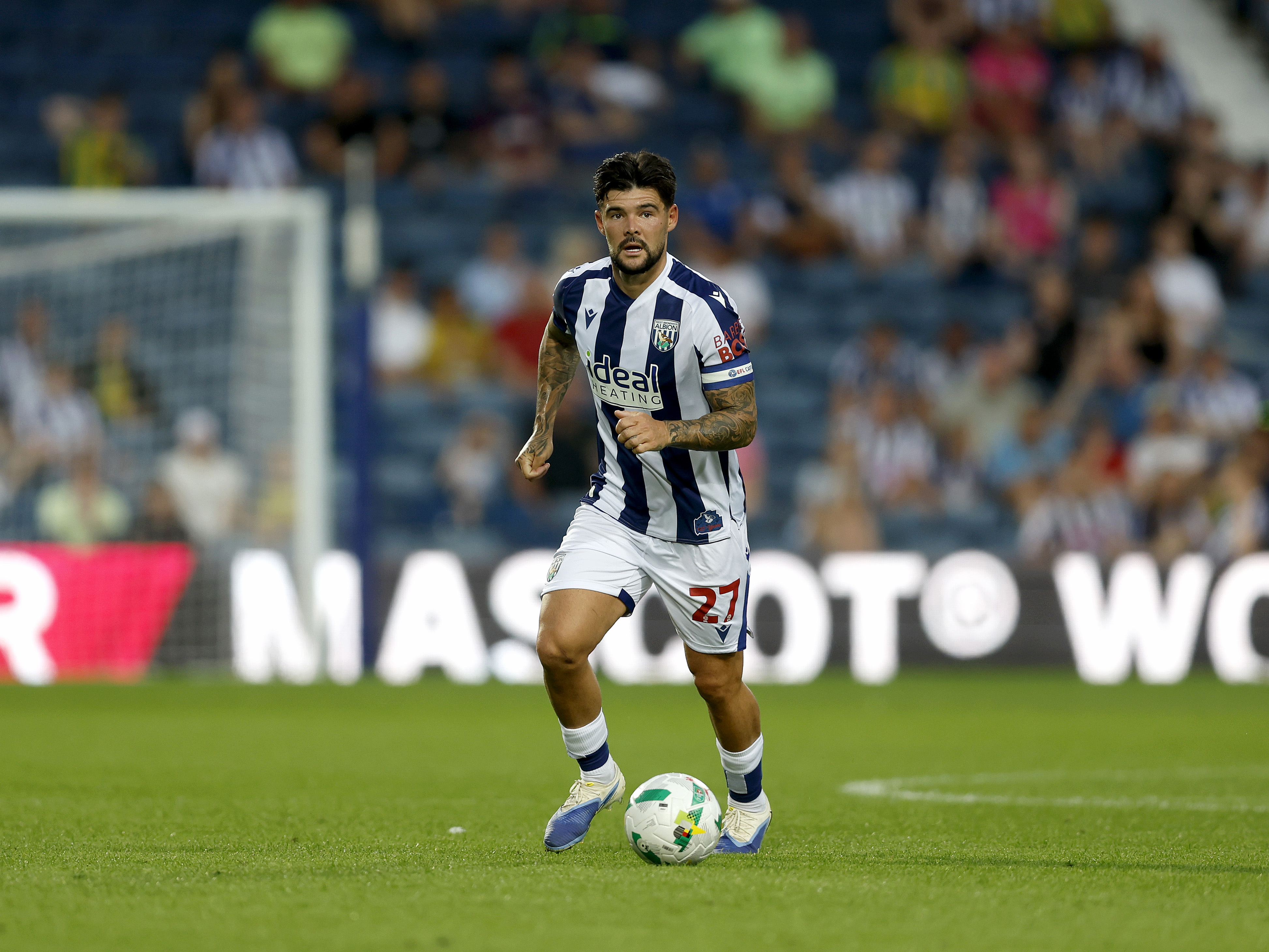 An image of Alex Mowatt on the ball