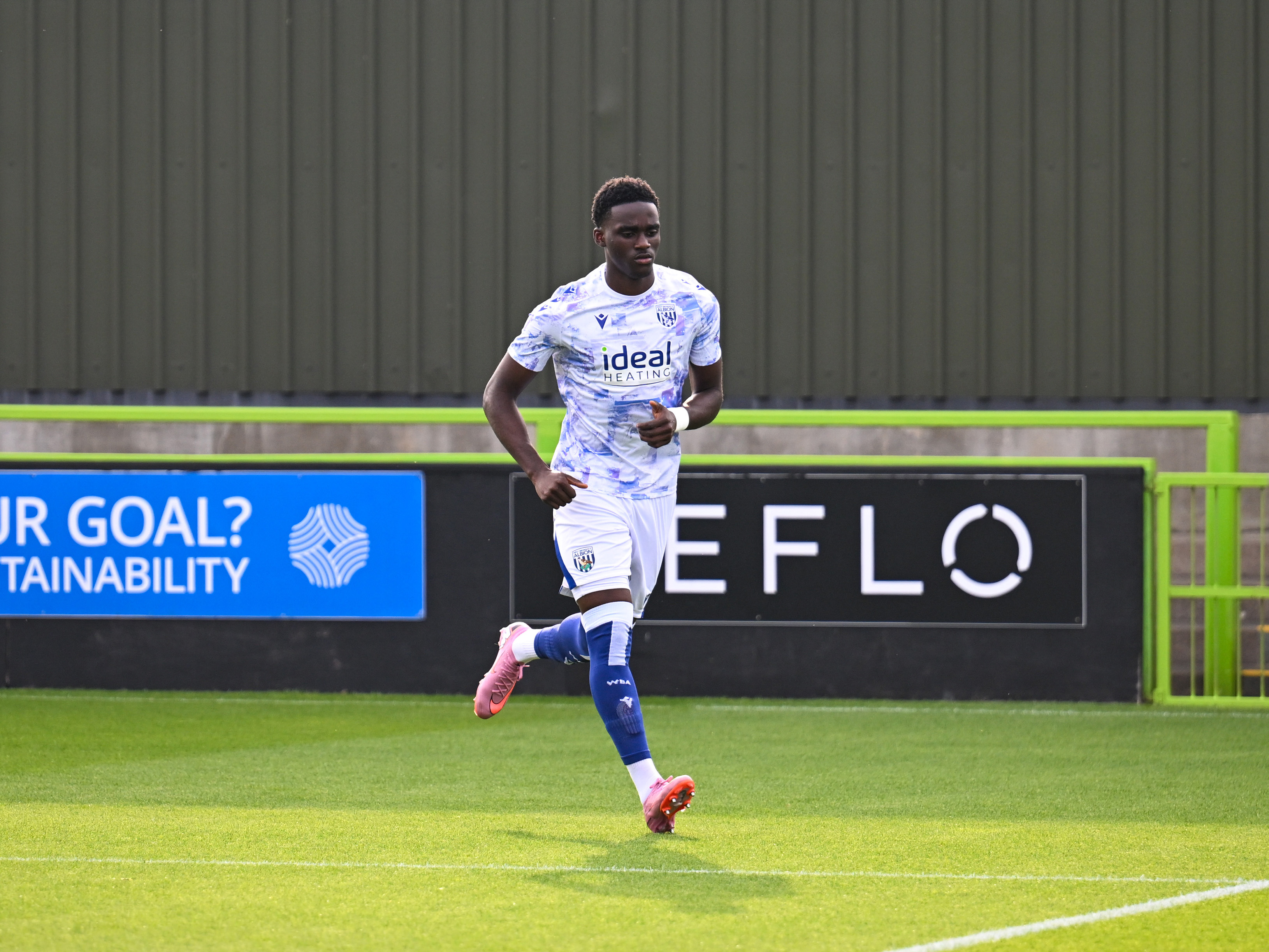A photo of Albion U21 striker Dan Chimeziri warming up ahead of a National League Cup match against Forest Green