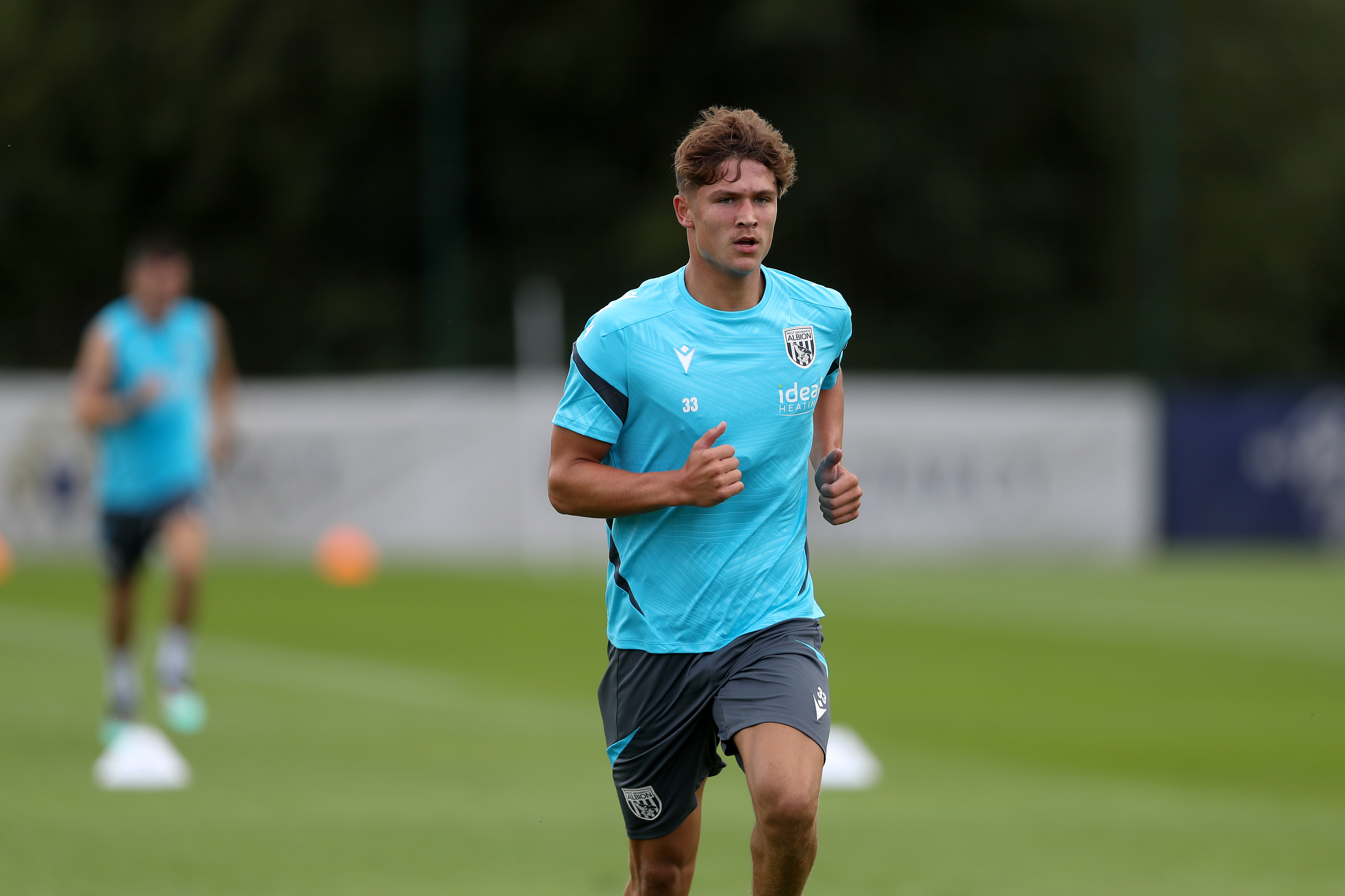 Cole Deeming running forward during a training session 