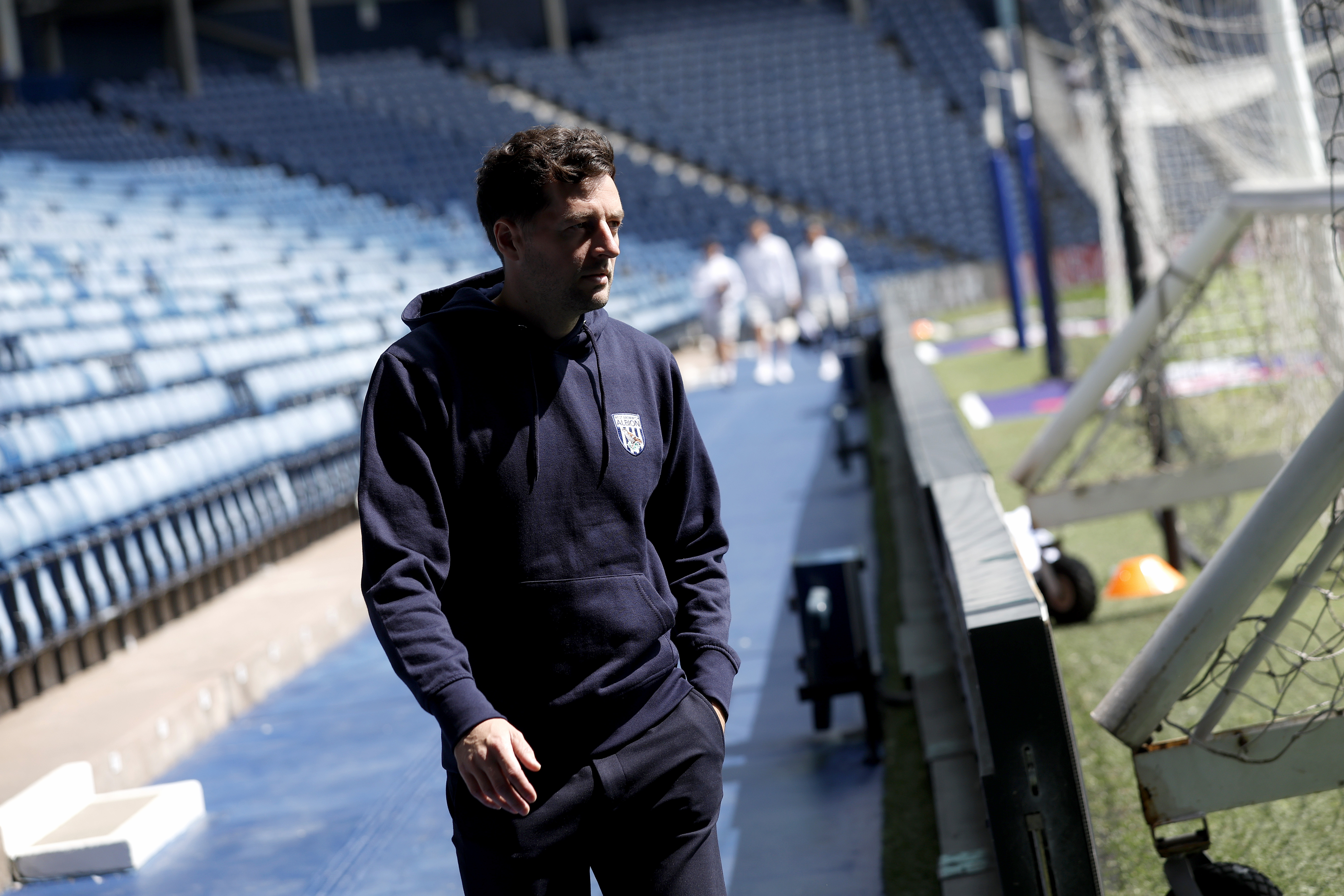 Ryan Mason walking around the blue track at The Hawthorns