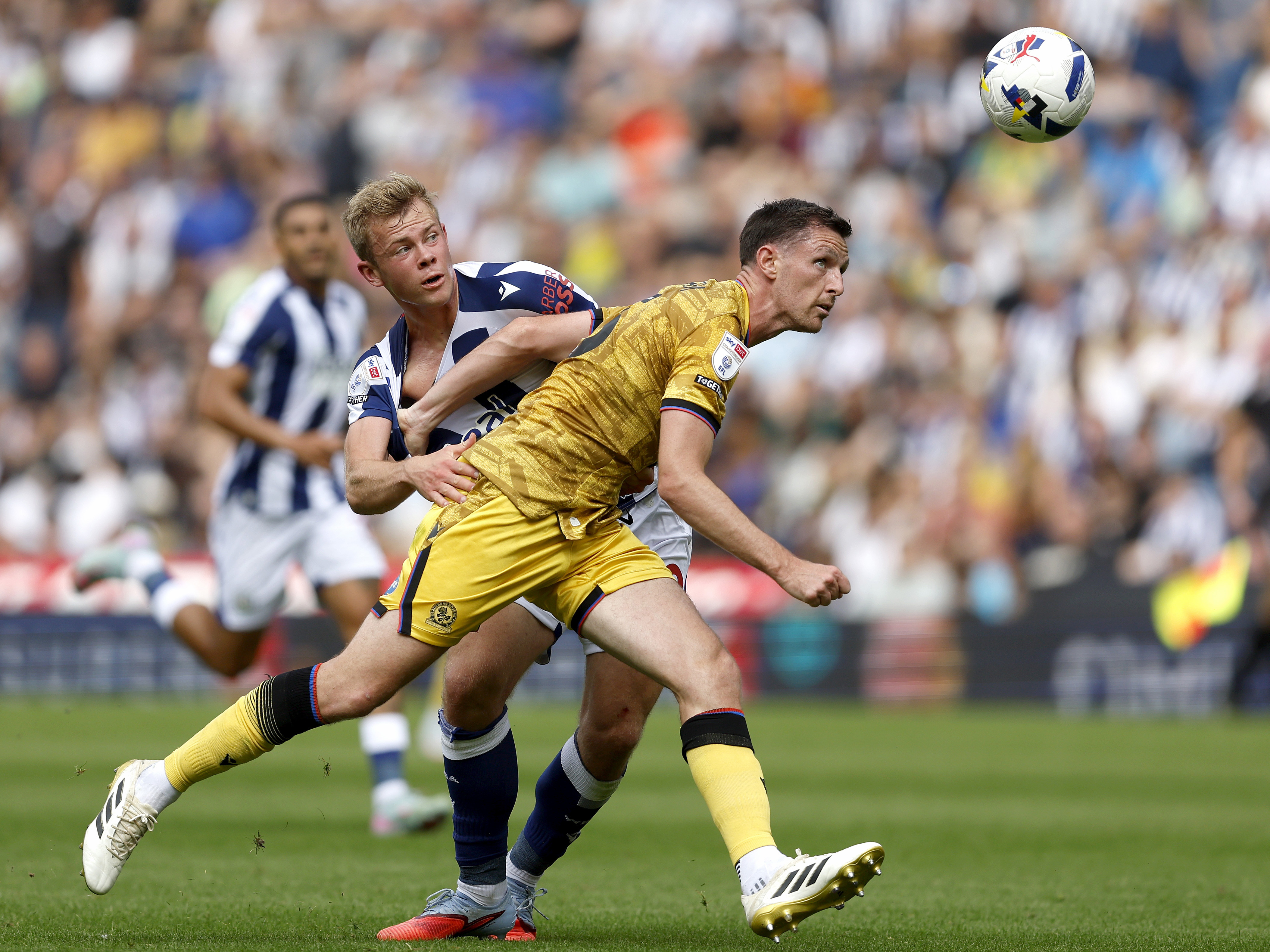 An image of Aune Heggebo battling with a Blackburn player