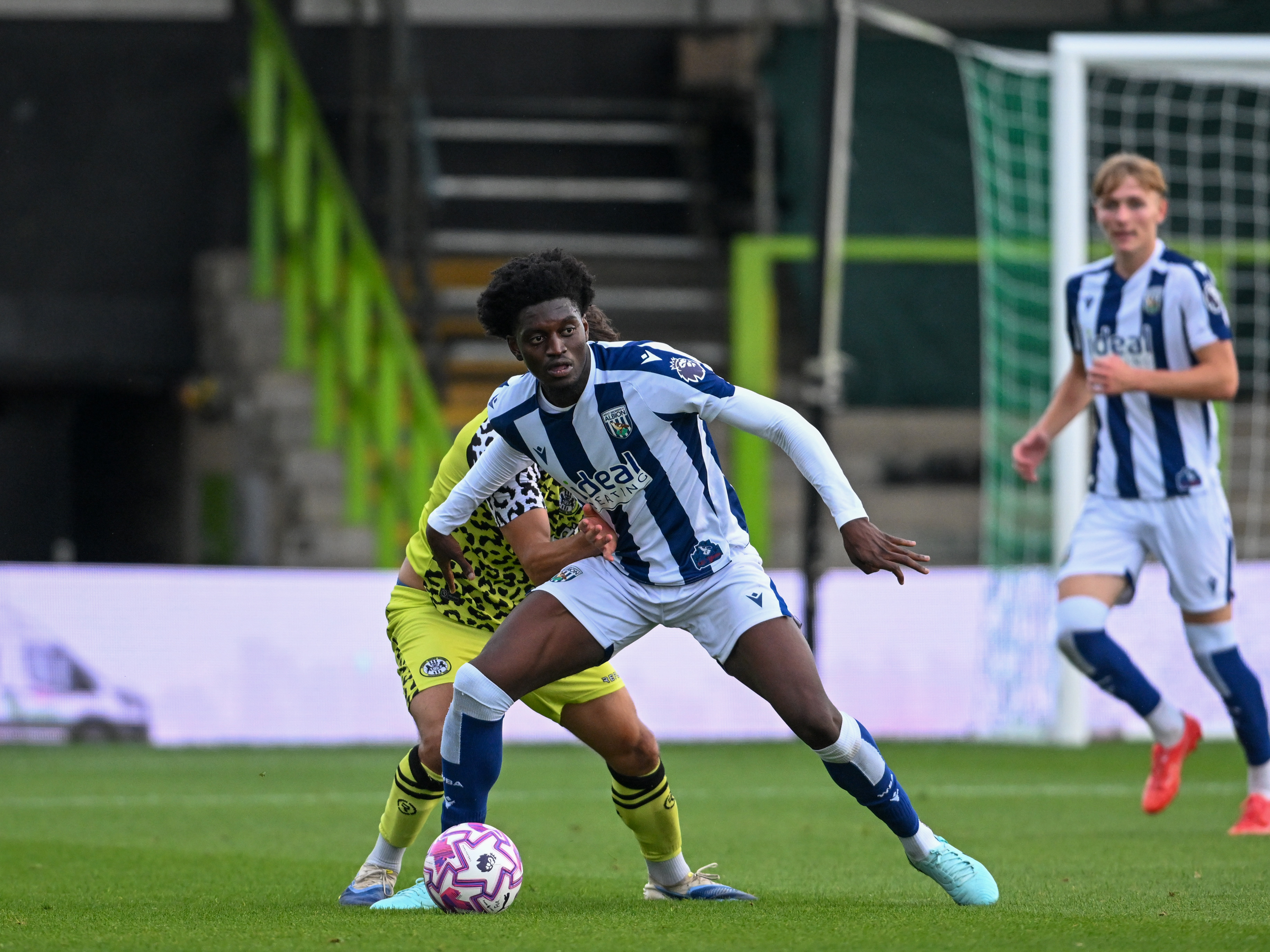A photo of Albion u21 defender Michael Parker in the 2025/26 home kit in action against Forest Green Rovers in the National League Cup