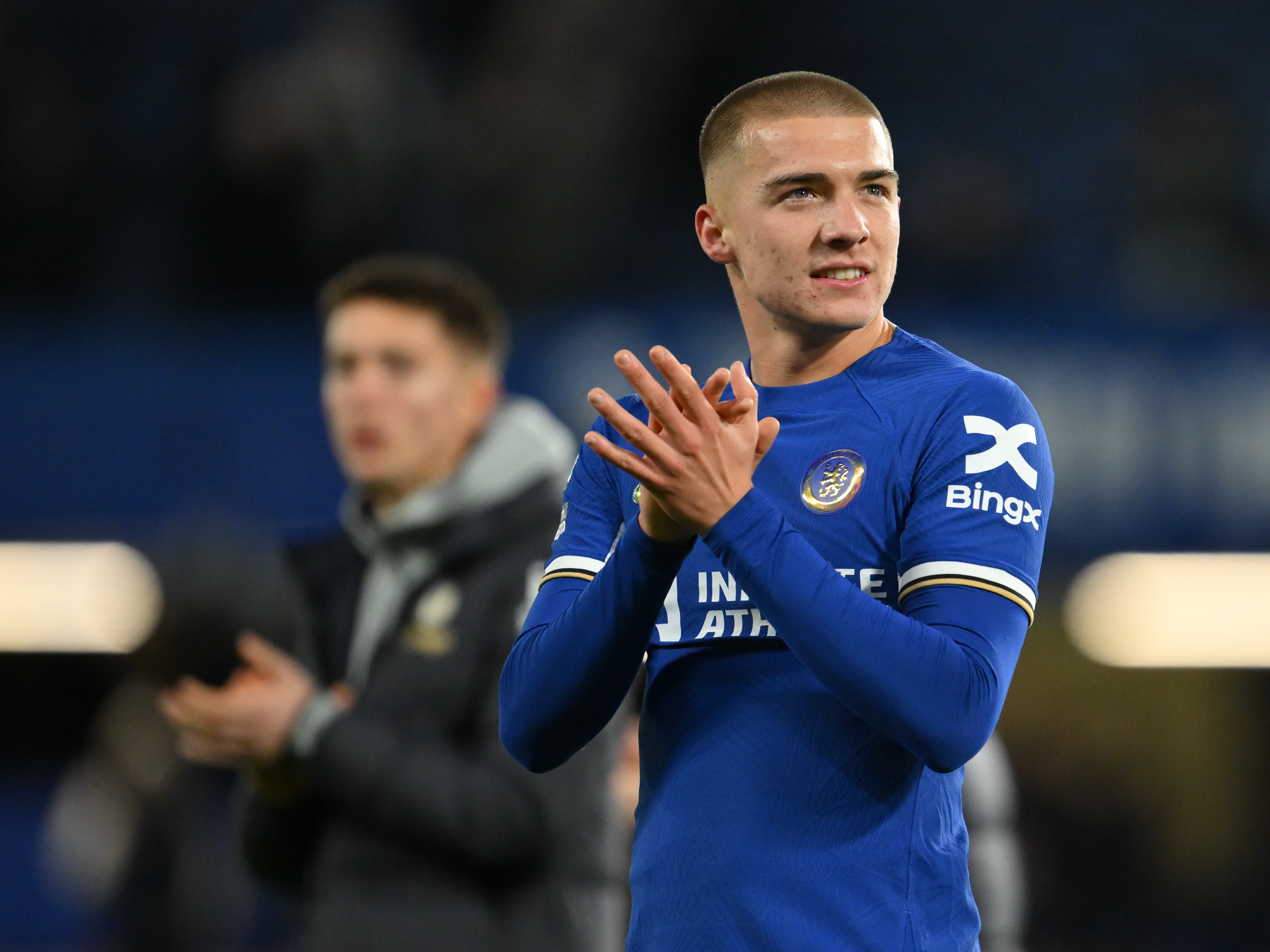 Alfie Gilchrist in a Chelsea shirt applauding supporters 
