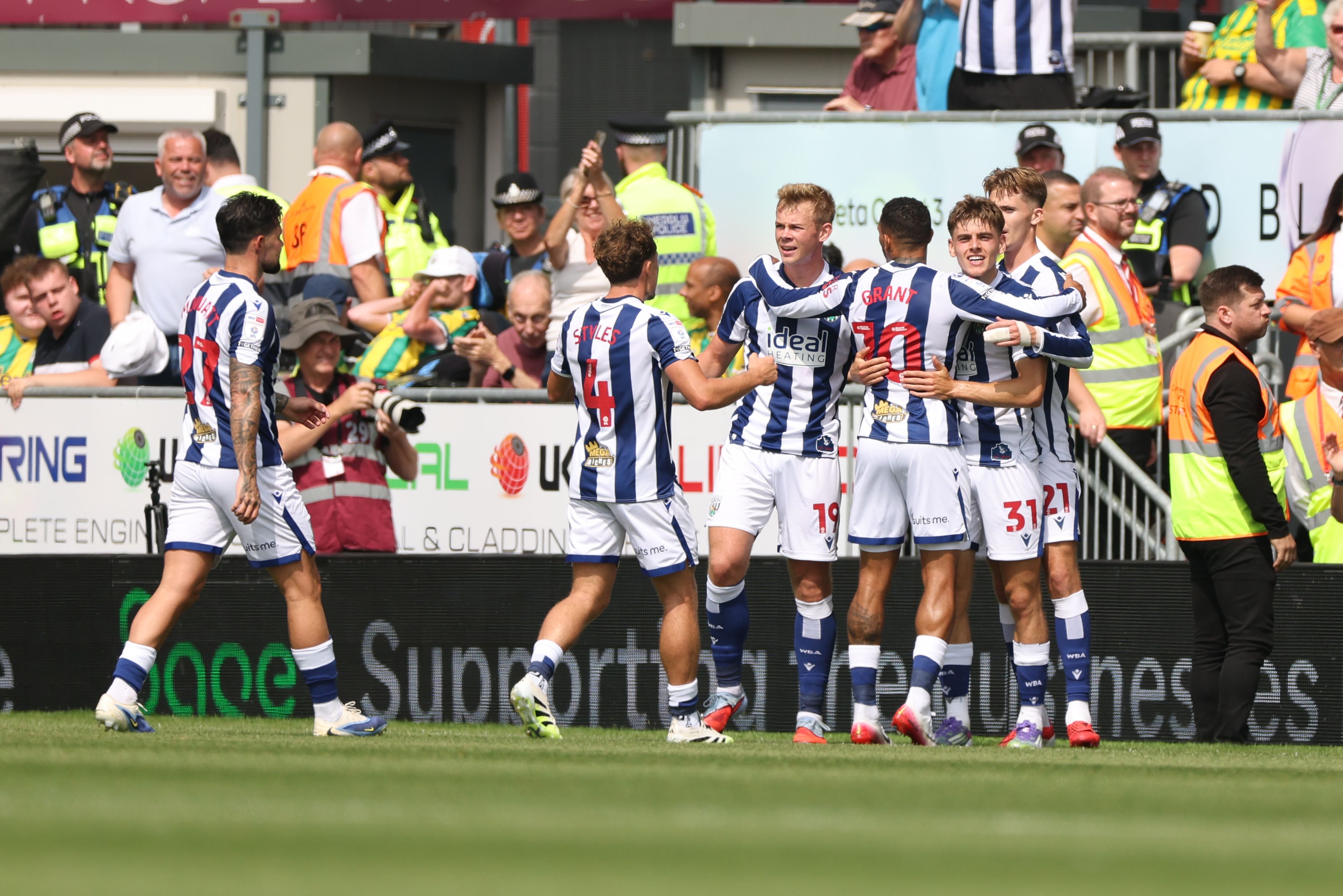 Isaac Price celebrates scoring his first goal at Wrexham with team-mates