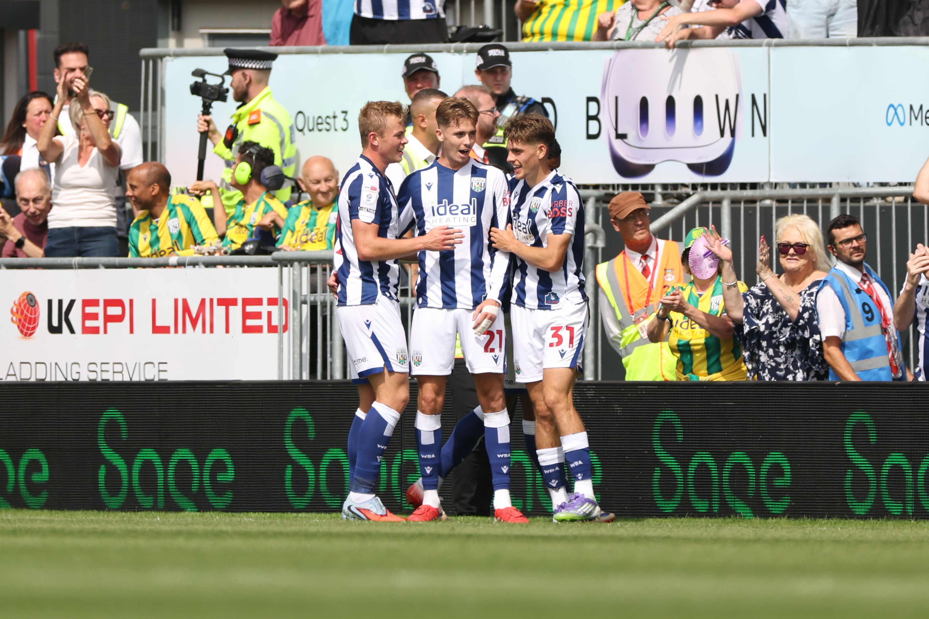 Isaac Price celebrates scoring his first goal at Wrexham with team-mates