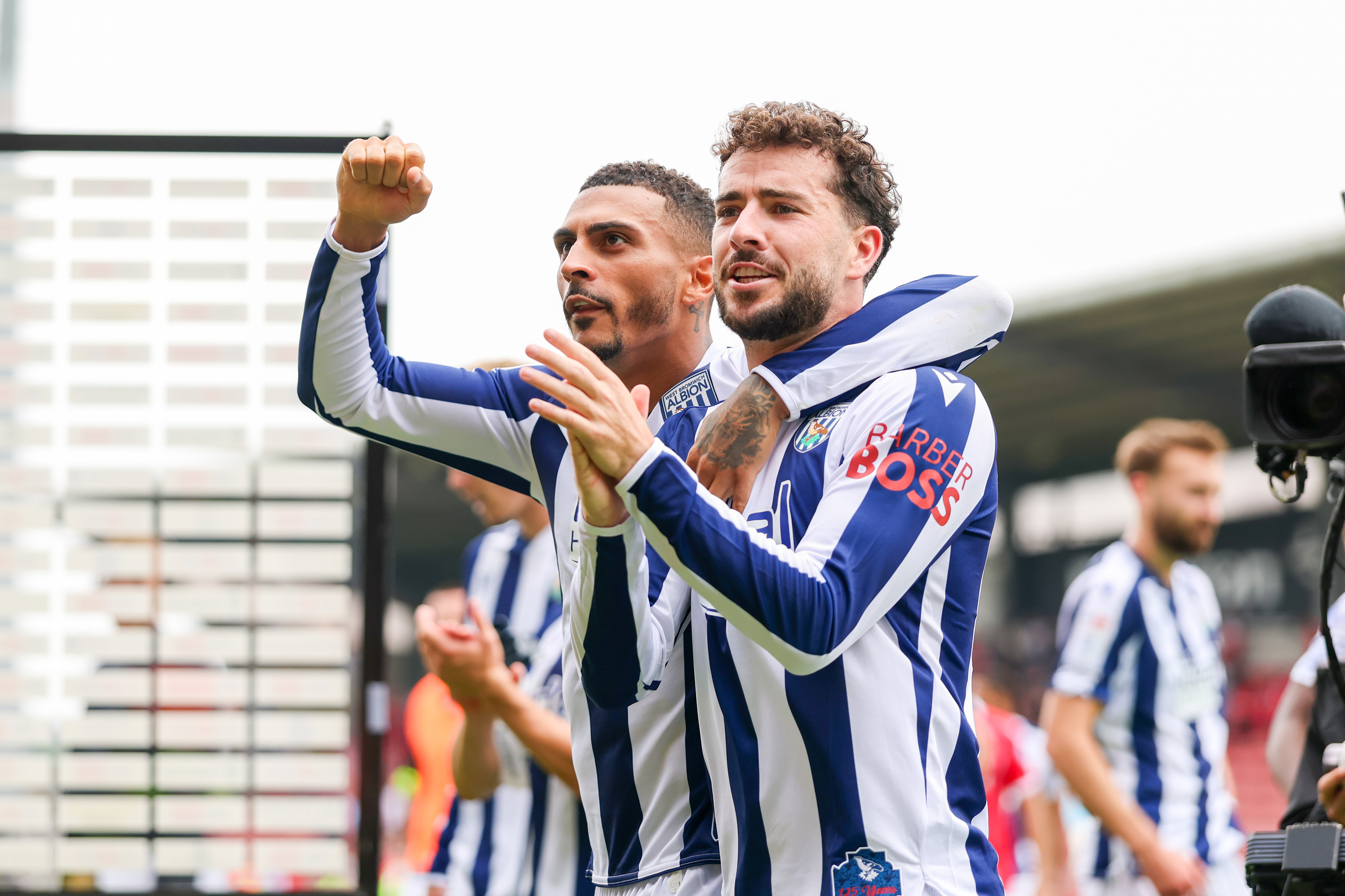 Karlan Grant and Mikey Johnston applaud WBA fans after beating Wrexham 