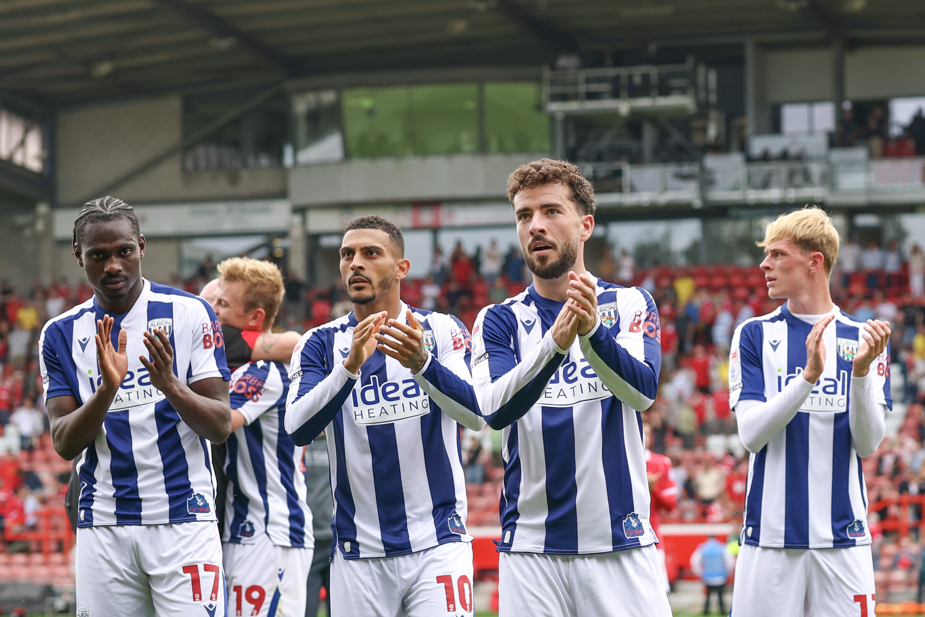 Several WBA players applaud WBA fans after beating Wrexham