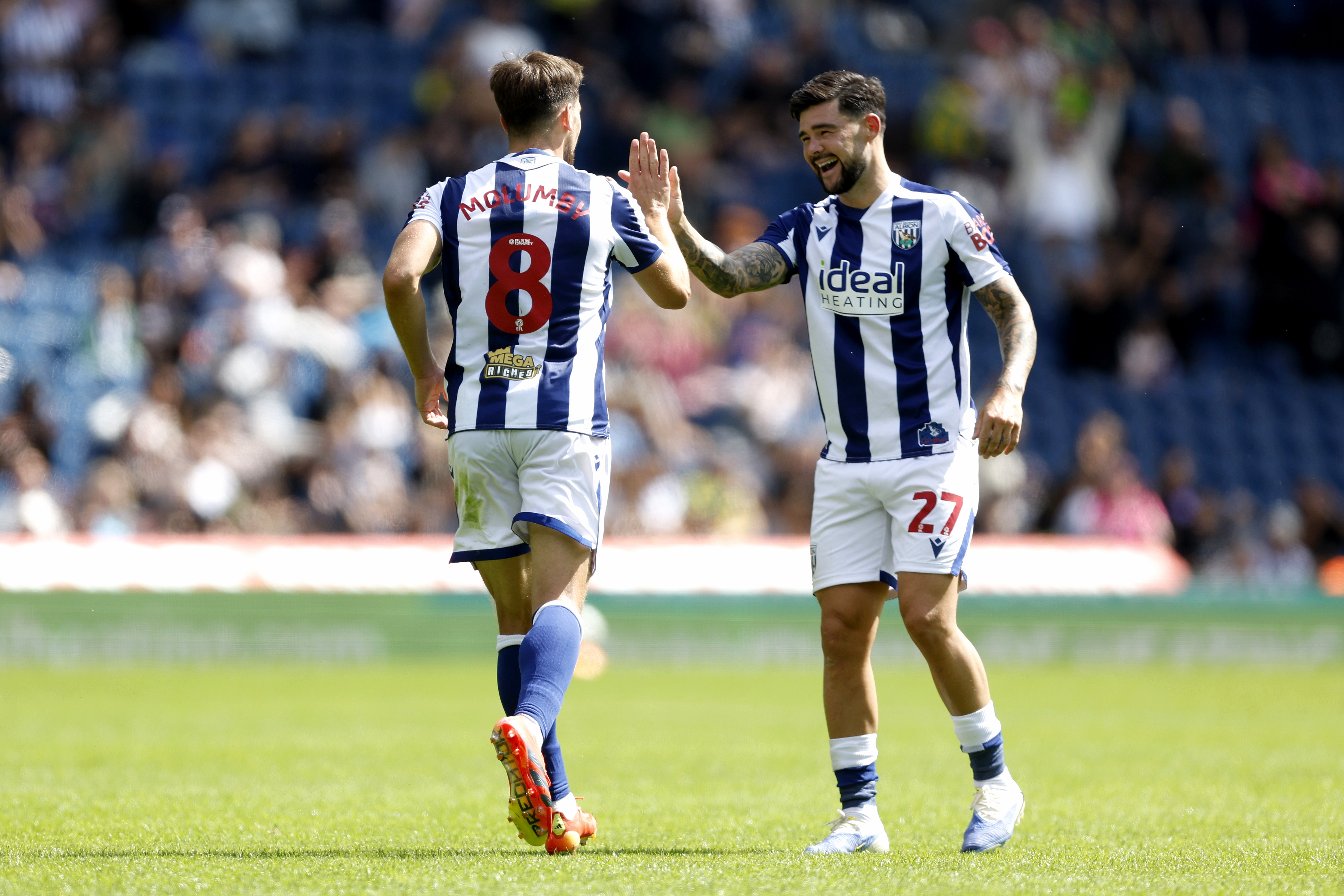 Jayson Molumby celebrates with Alex Mowatt after scoring against Rayo Vallecano