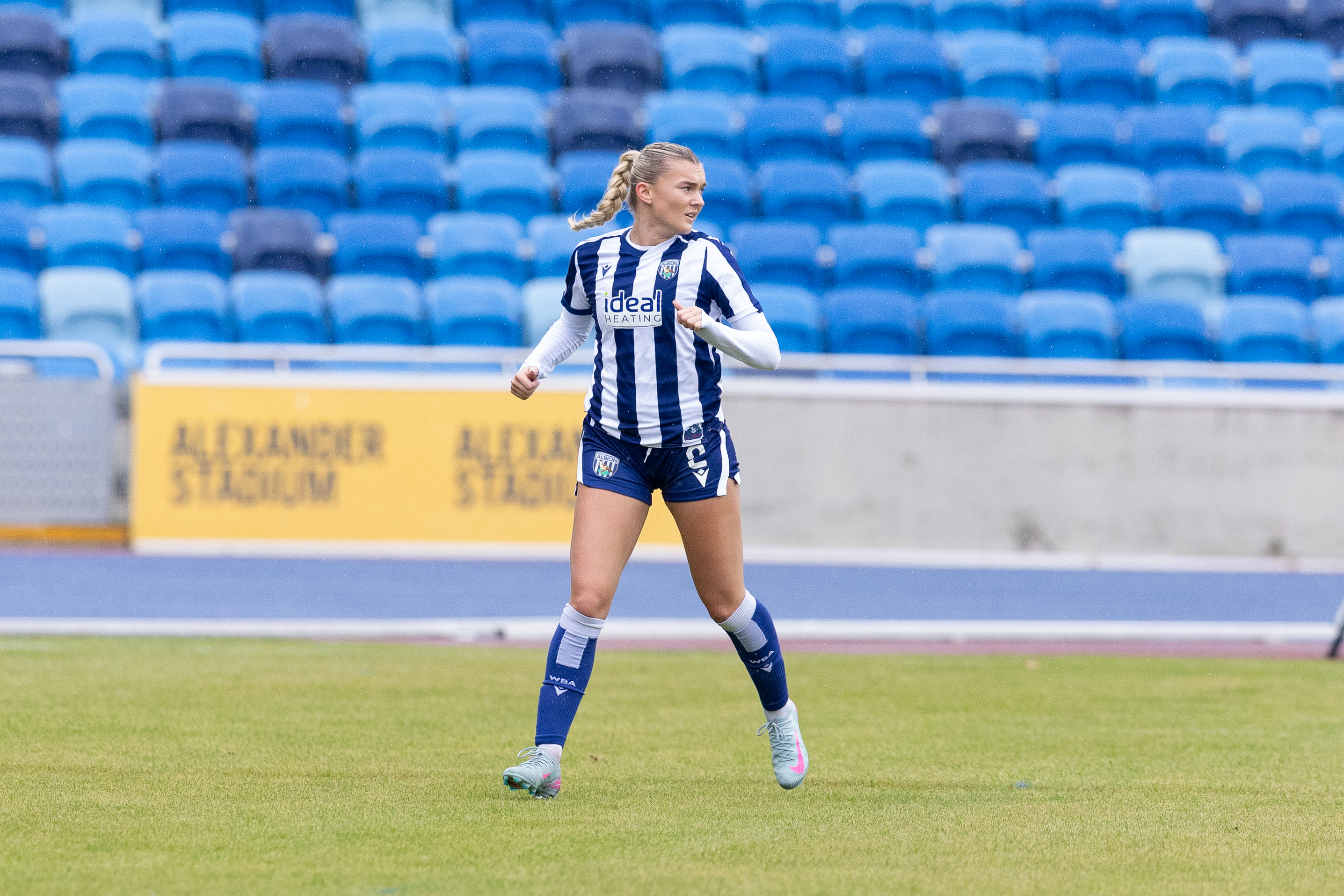 Taylor Reynolds in action for WBA Women in the home kit 