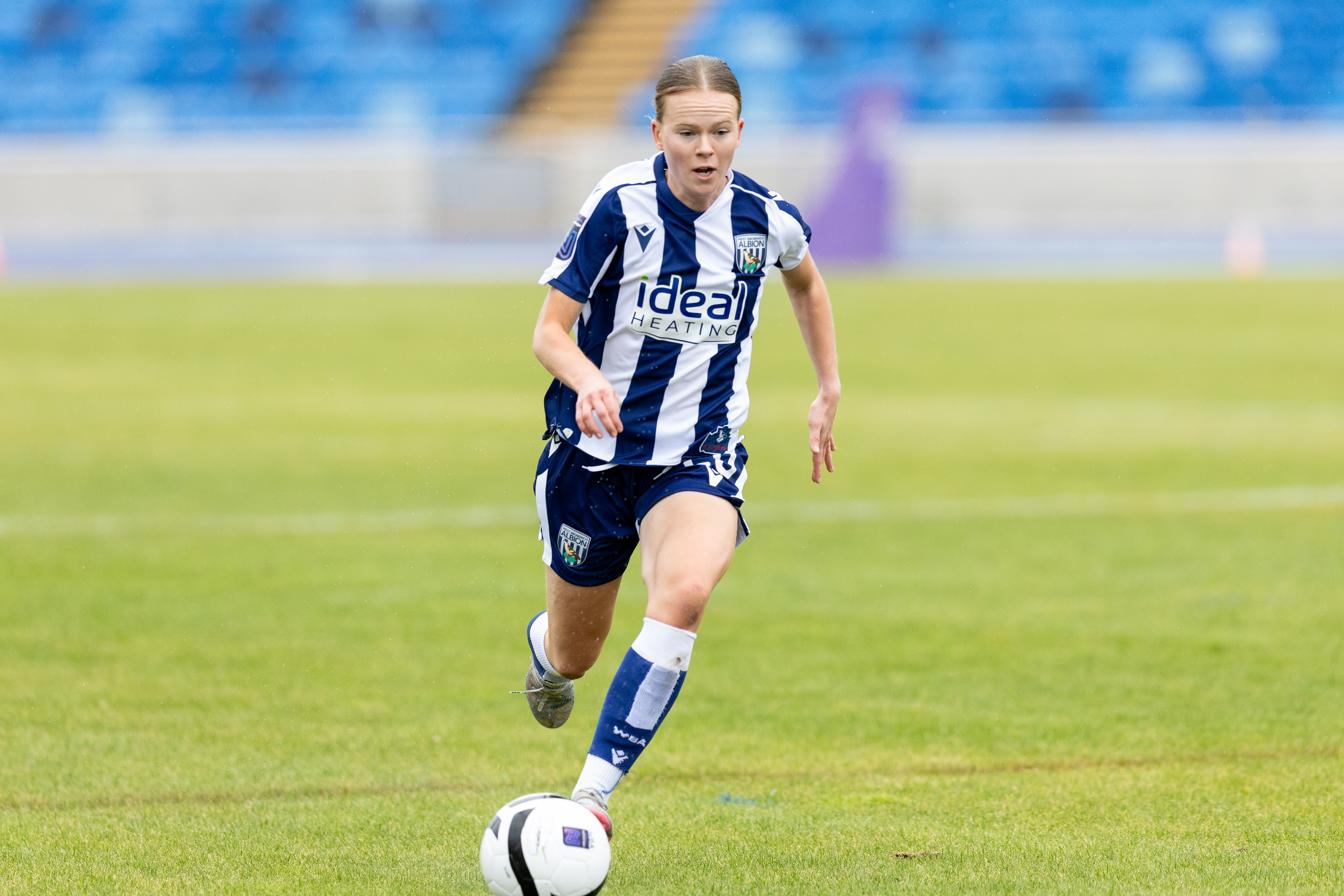 Phoebe Warner in action for WBA Women in the home kit 