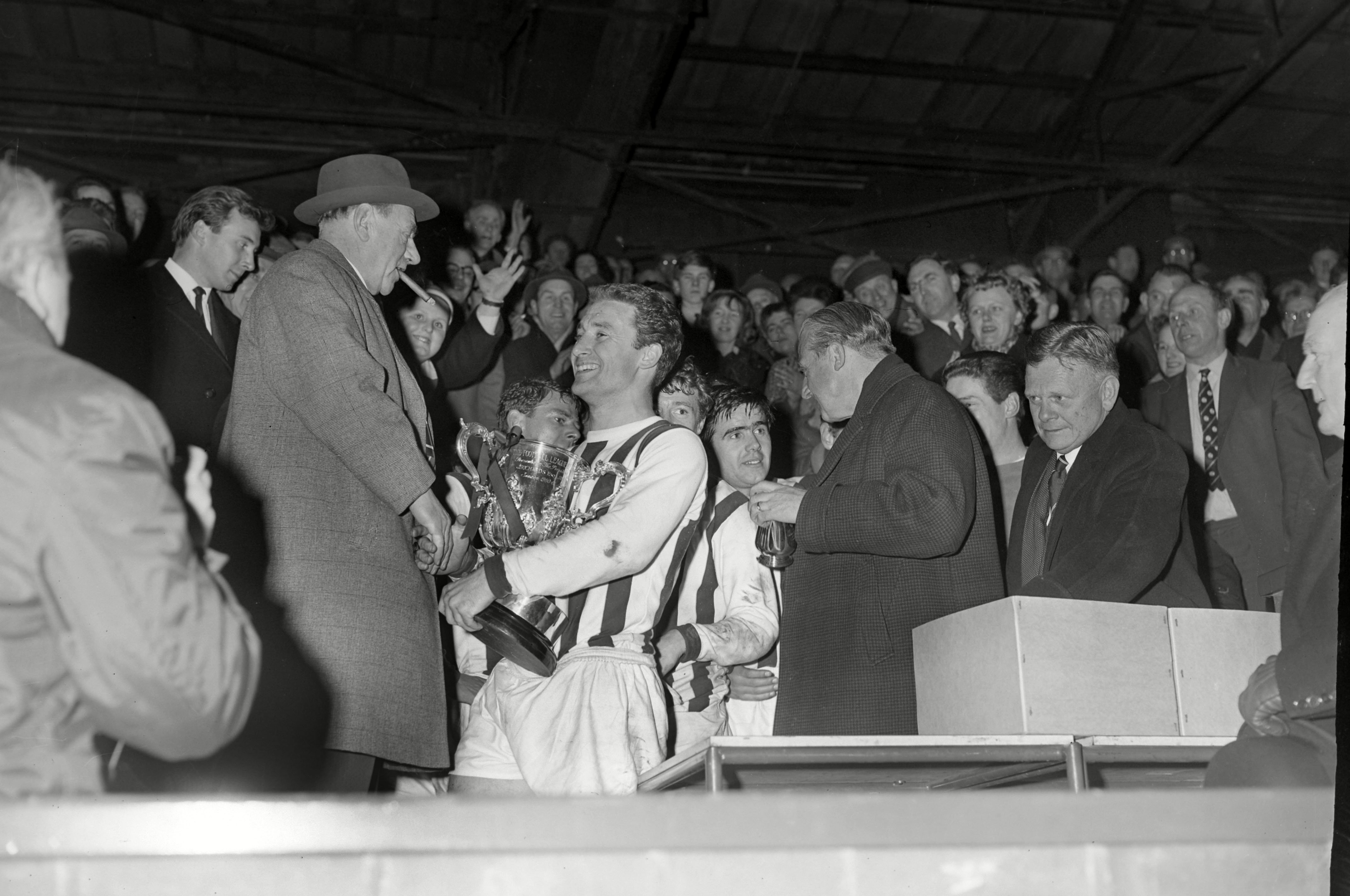 Graham Williams receives the League Cup trophy in 1966 at The Hawthorns in the stand