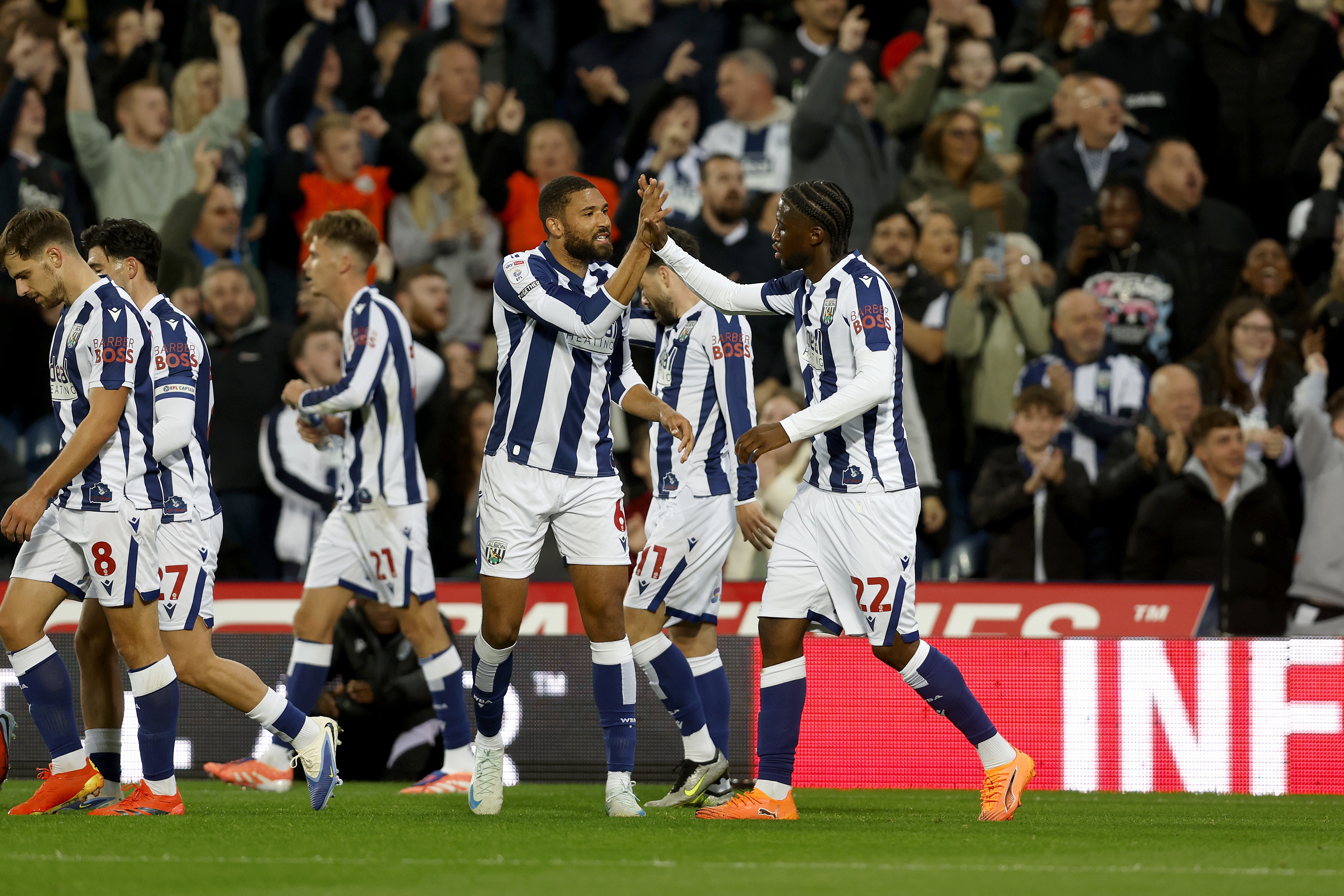 Samuel Iling-Junior celebrates scoring against Leicester with team-mates