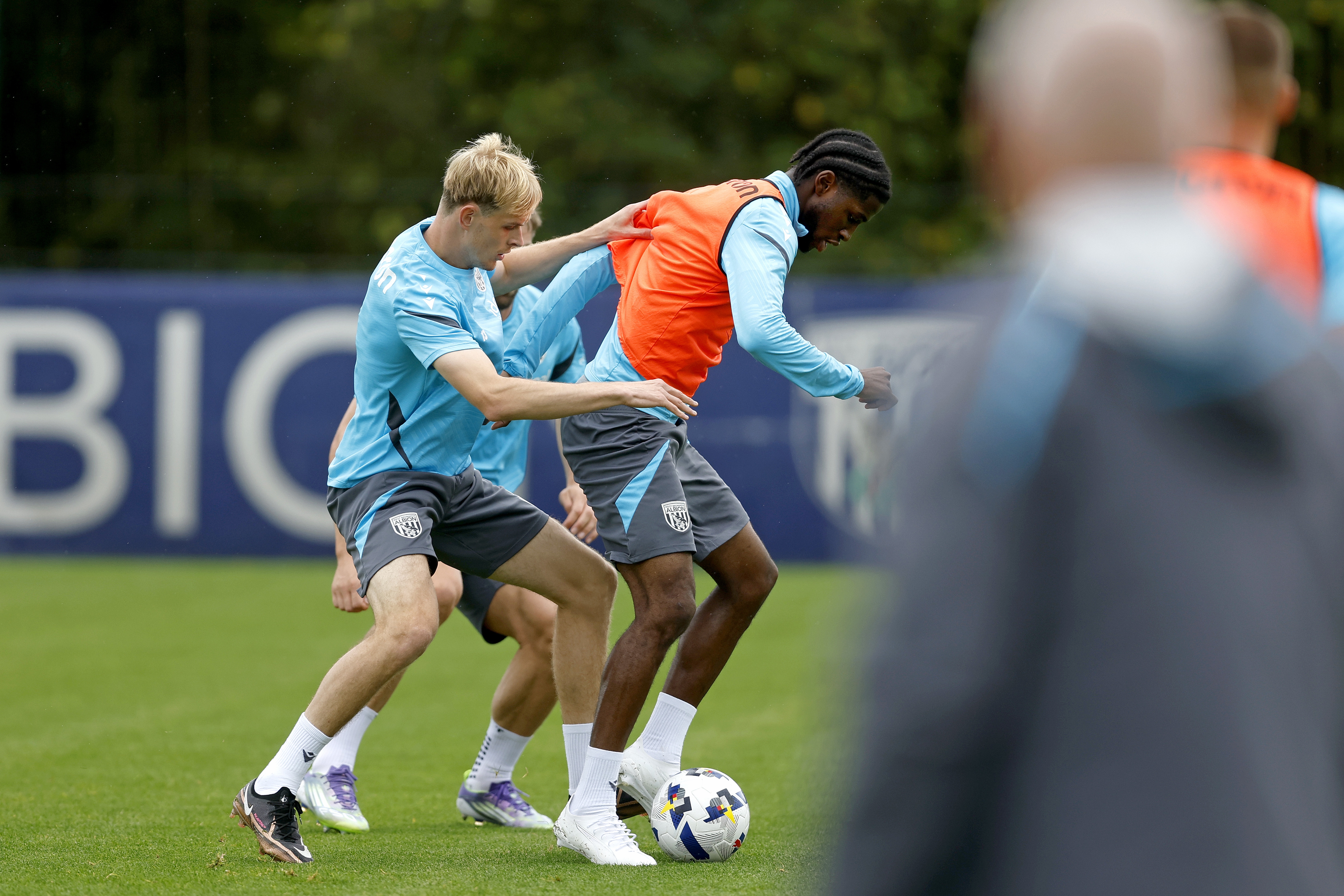 Toby Collyer and Samuel Iling-Junior fighting for the ball during training 